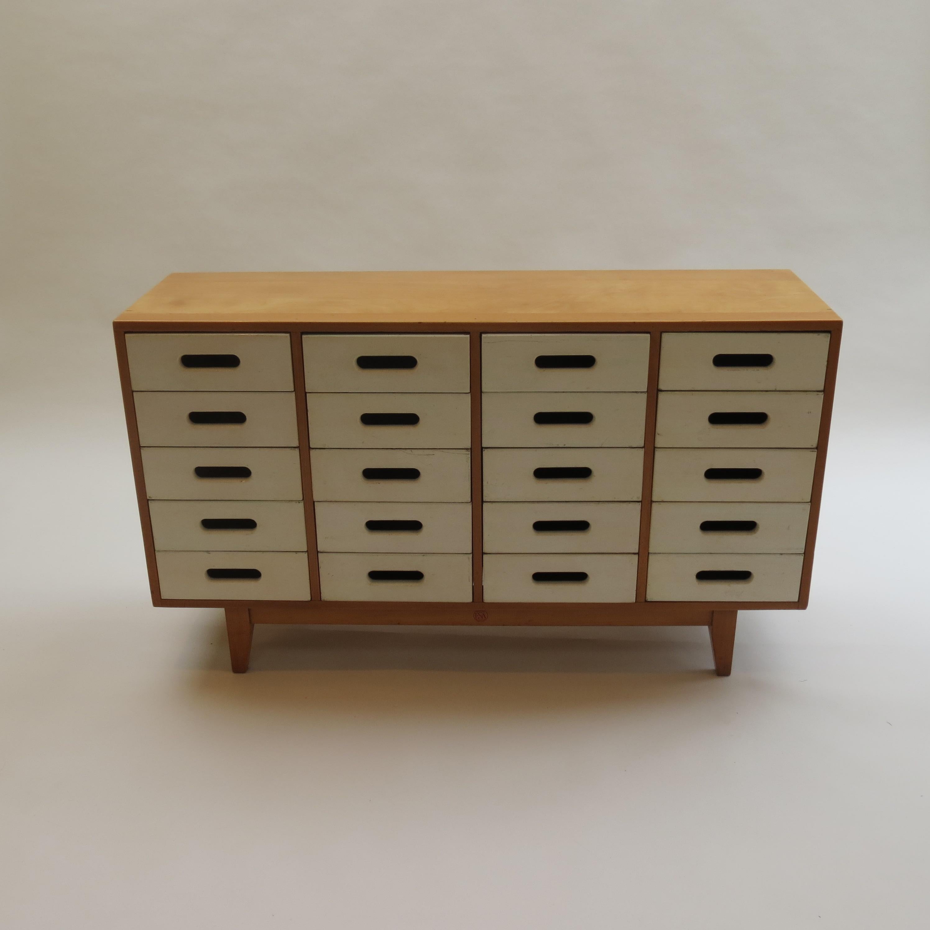 Chest of drawers designed by James Leonard in the 1950s and produced by Esavian, ESA in the United Kingdom. 

Painted solid beech drawer fronts and birch plywood case. The drawer fronts have been over painted at some point and there is some