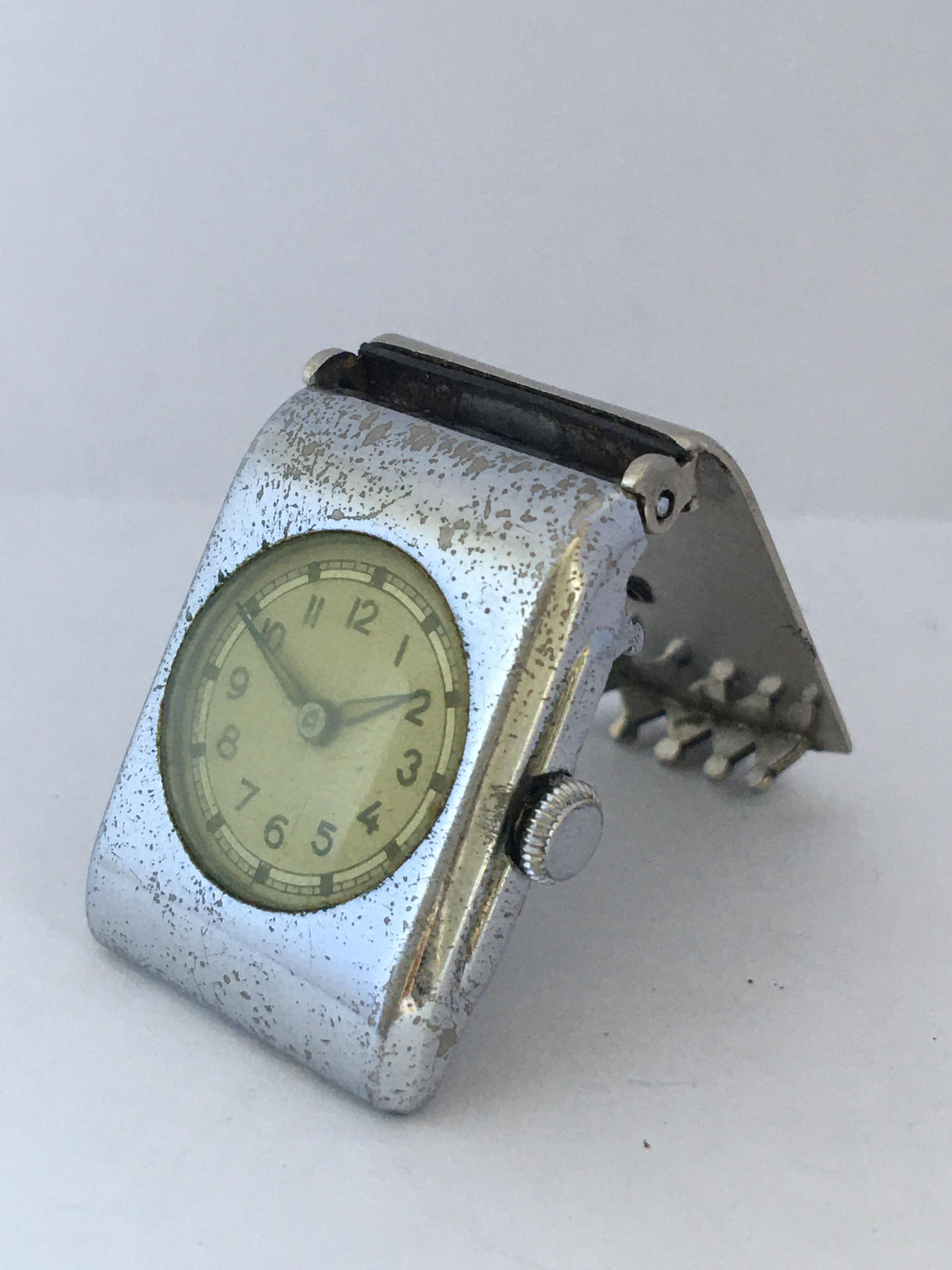 This pre-owned vintage hand winding clip on watch is work and it is ticking well. Visible signs of ageing and wear with the chrome metal case is tarnished as shown. the glass is a bit cloudy as shown. 