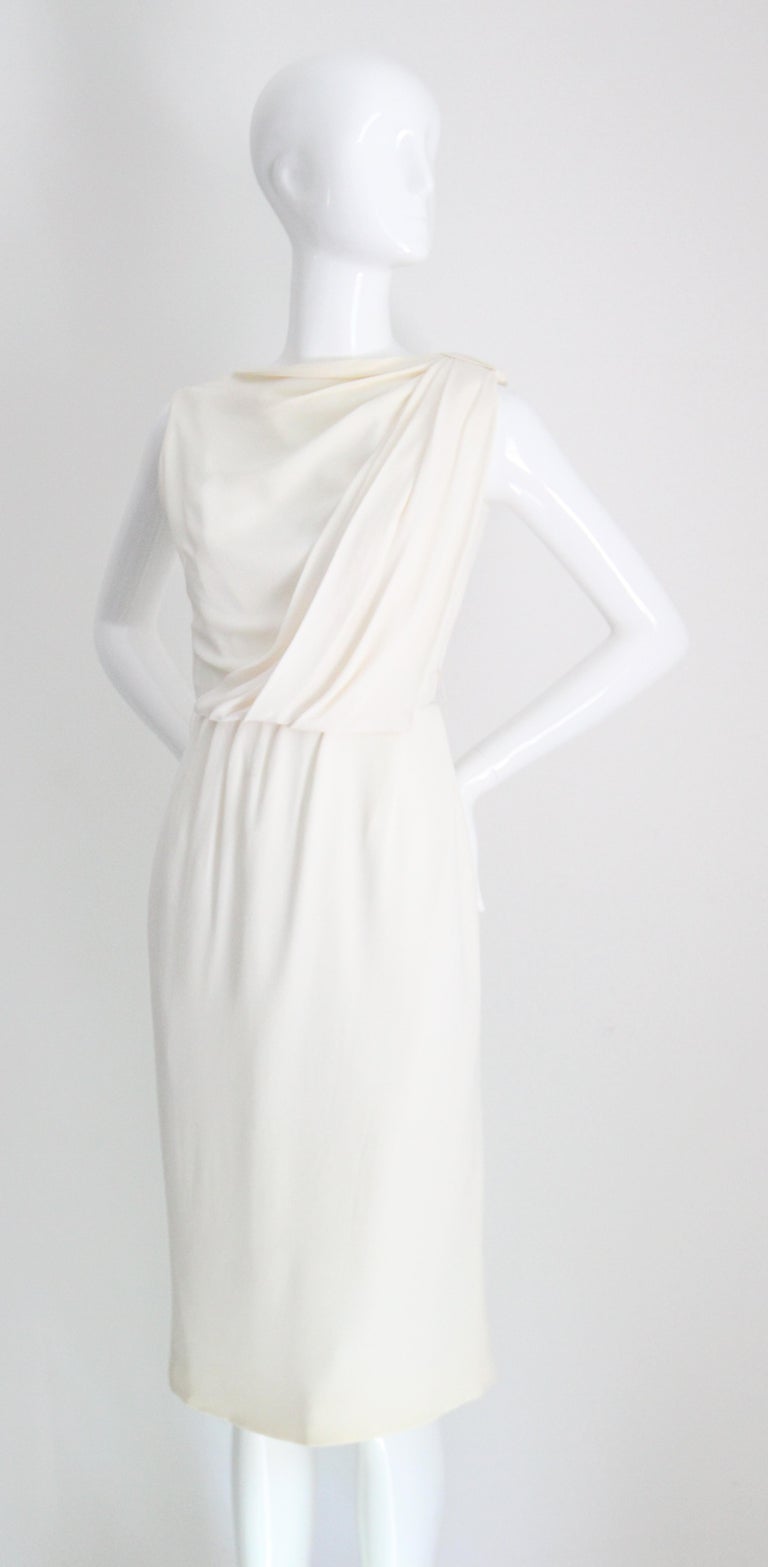 cream wiggle dress SOLD exclusively on IG! You know I love a good high collar, it's such a  chic style. An absolutely killer early 1960s lightweight cream wool knit  hourglass wiggle dress, completely covered by