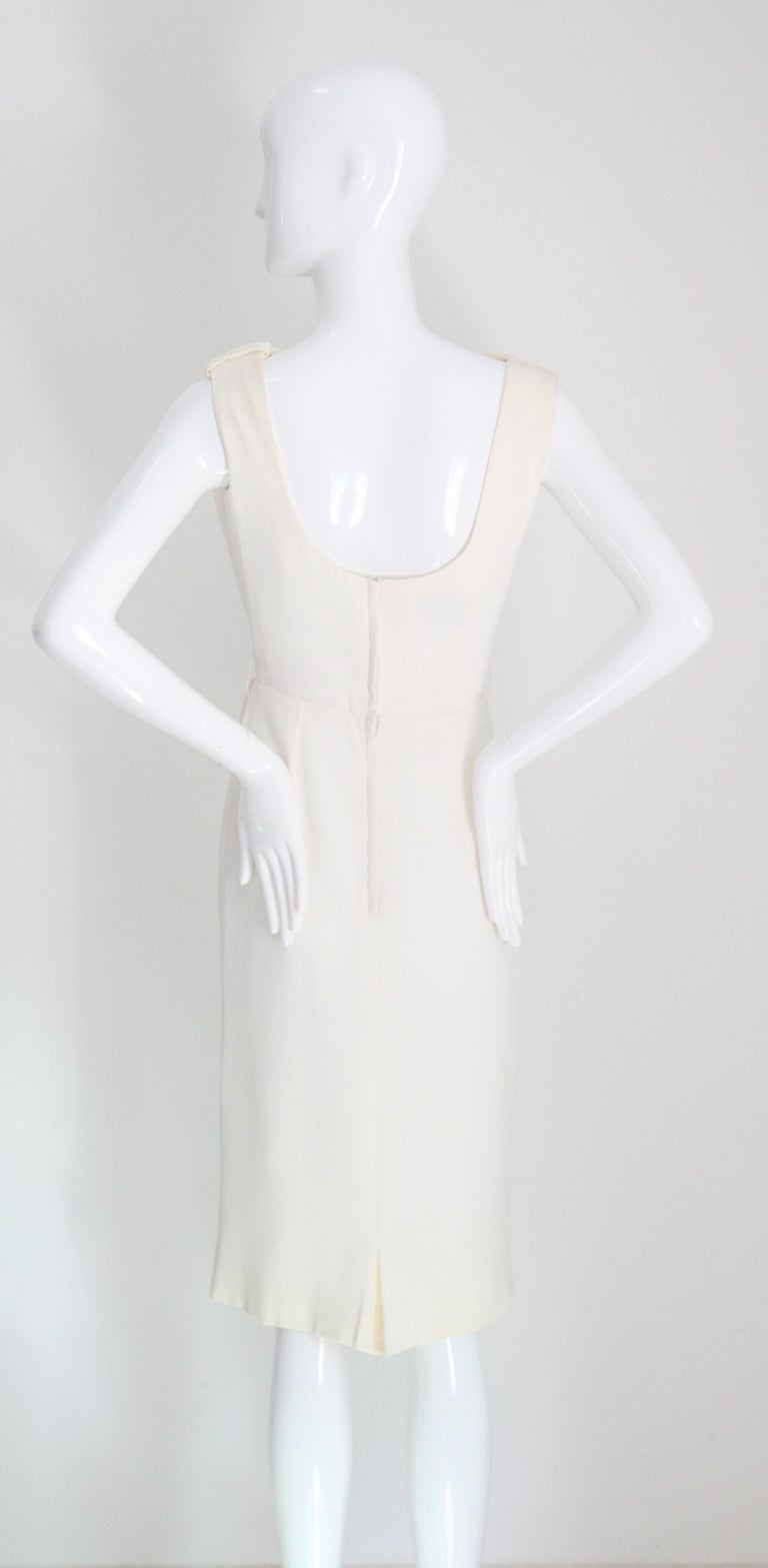 cream wiggle dress SOLD exclusively on IG! You know I love a good high collar, it's such a  chic style. An absolutely killer early 1960s lightweight cream wool knit  hourglass wiggle dress, completely covered by