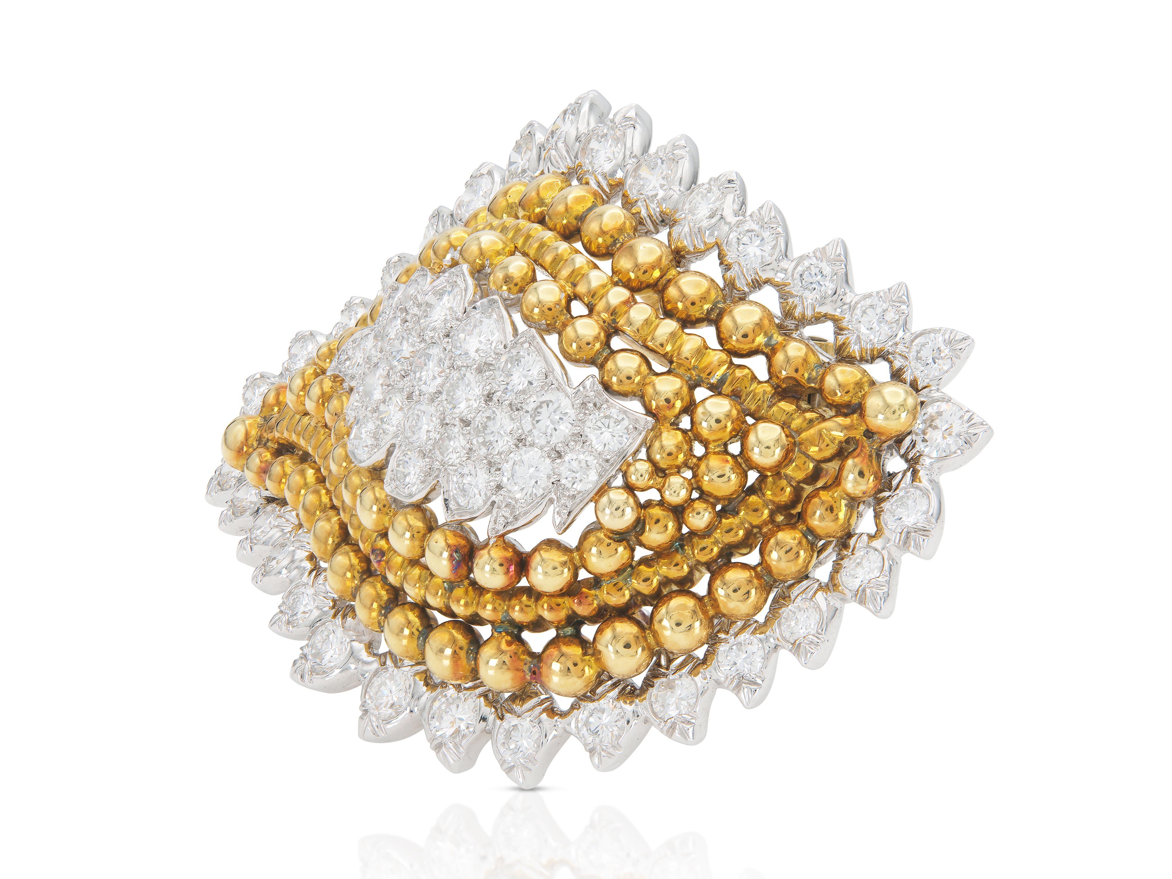Finely crafted in 18k yellow gold and platinum with Round Brilliant cut Diamonds weighing approximately a total of 6.50 carats.
Signed by David Webb
Circa 1950s
2 1/4 x 1 1/2 inch
