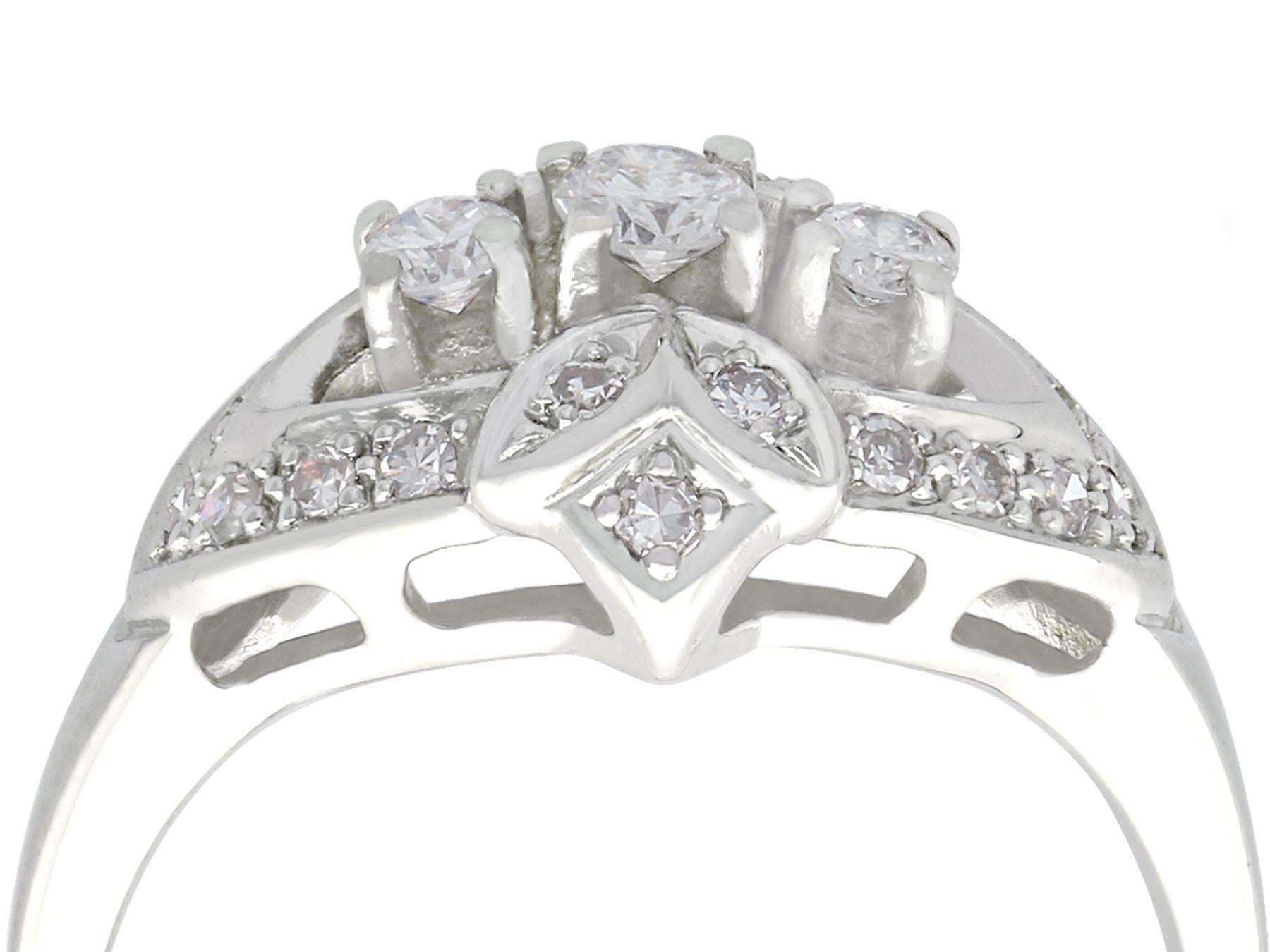 An impressive vintage 1950s 0.50 carat diamond and 14 karat white gold cocktail ring; part of our diverse diamond jewelry and estate jewelry collections.

This fine and impressive diamond cocktail ring has been crafted in 14k white gold.

The