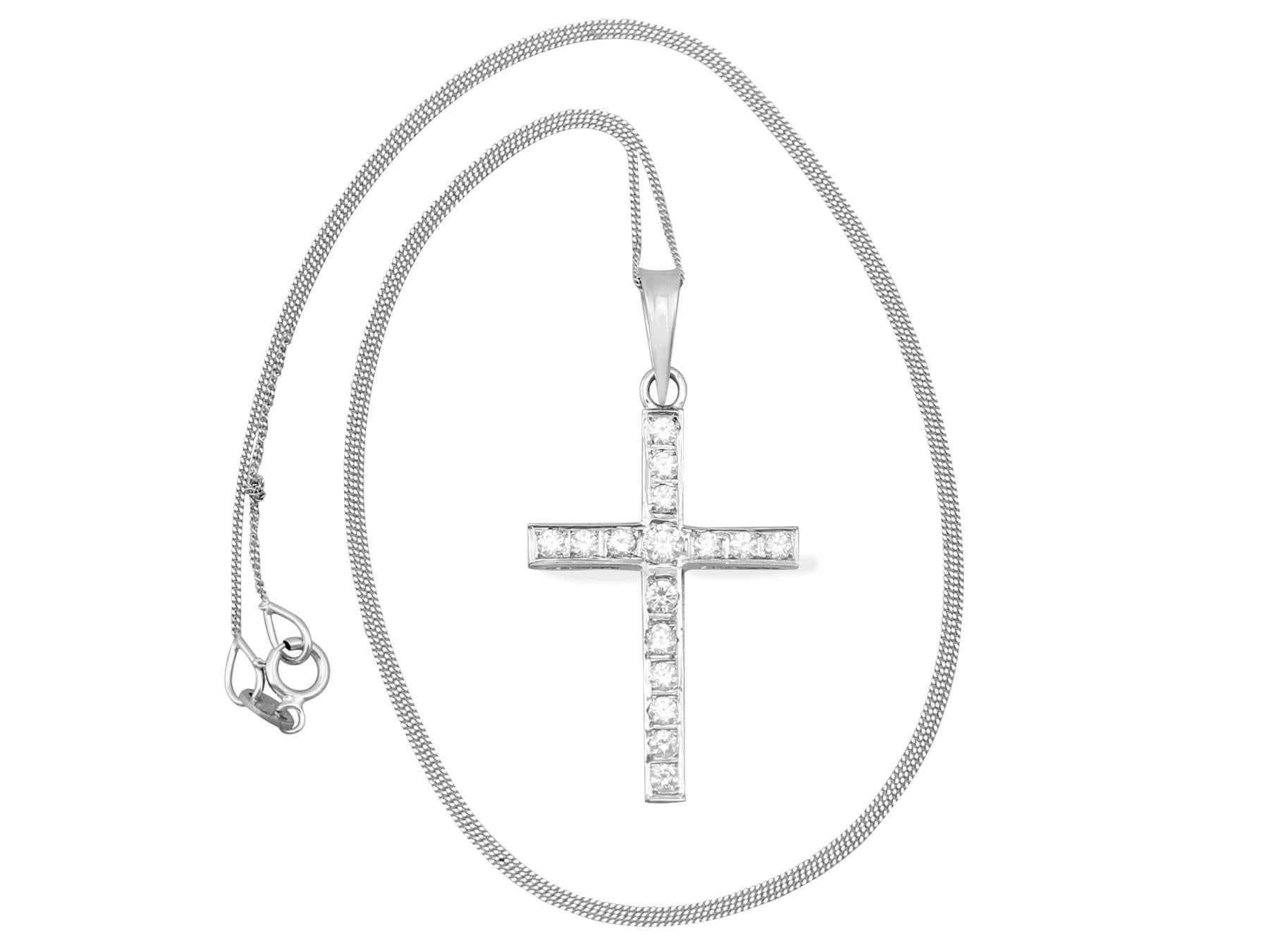 An impressive vintage 1950s 0.60Ct diamond and 18k white gold cross pendant and chain; part of our diverse diamond jewelry and estate jewelry collections.

This fine and impressive vintage diamond cross pendant has been crafted in 18k white