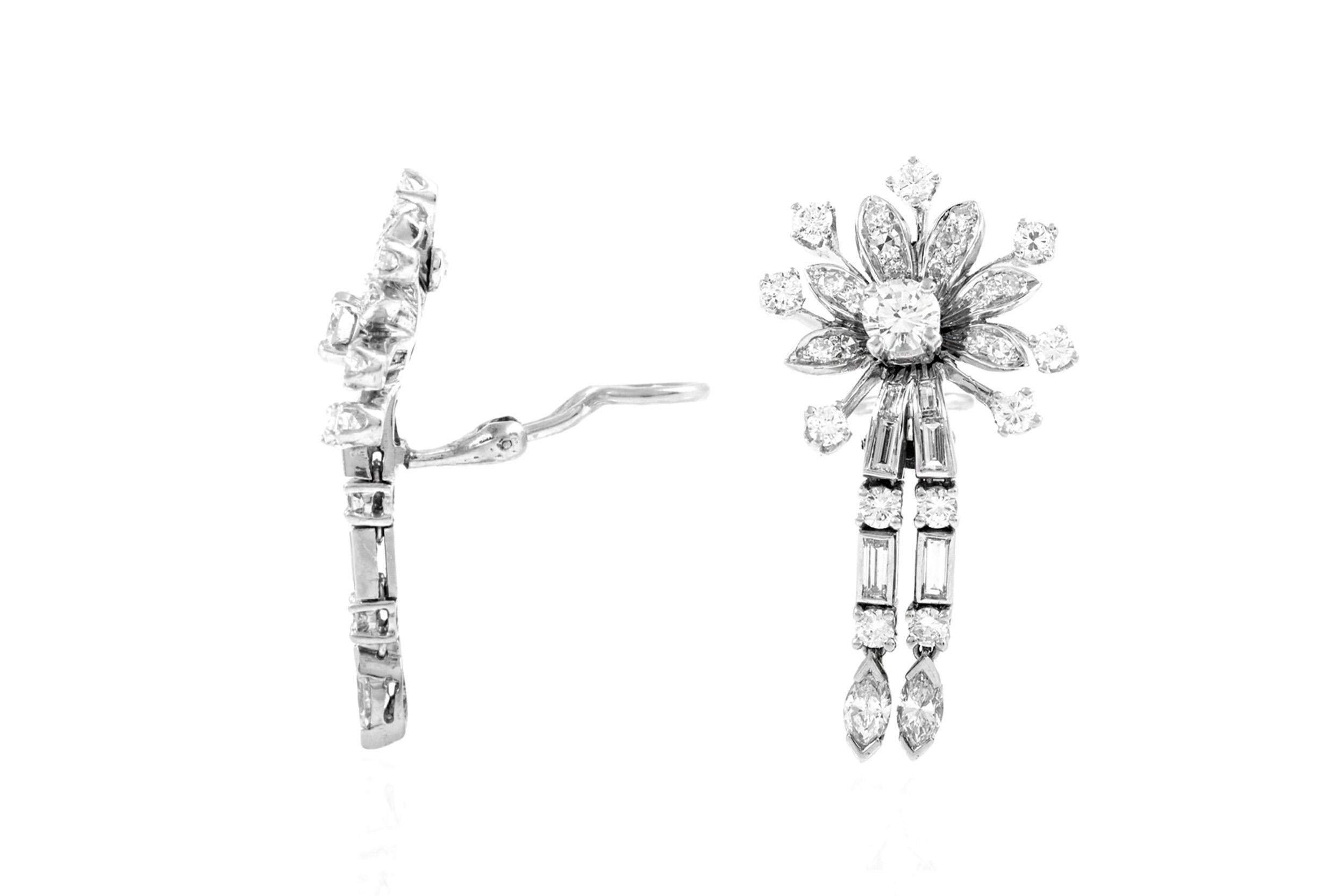 Finely crafted in platinum and 14k white gold with Round Brilliant, Baguette, and Marquise cut Diamonds weighing a total of approximately 7.00 carats.
Circa 1950s
1 1/2 x 3/4 inches