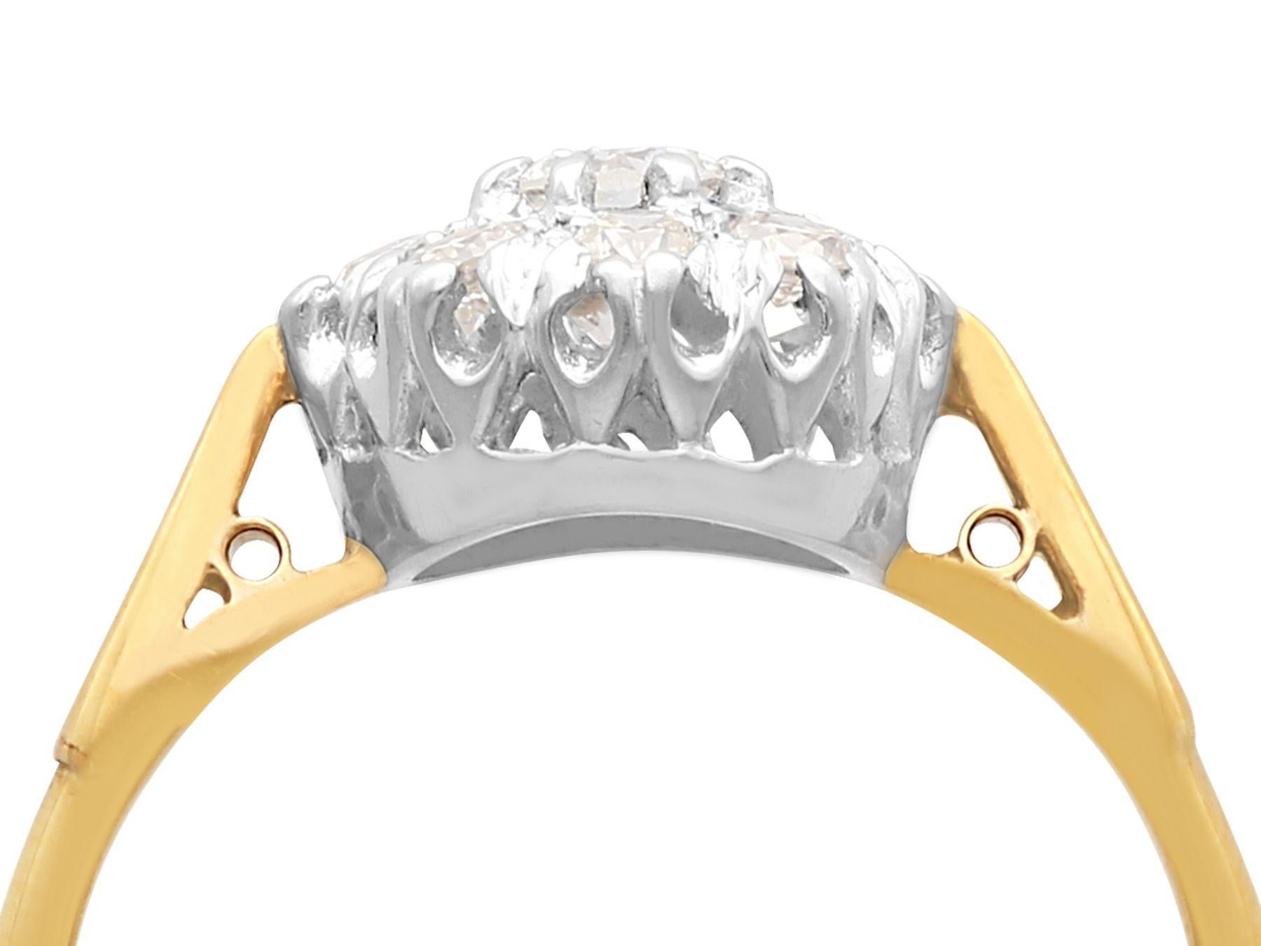 A fine and impressive vintage 0.45 carat diamond cluster ring, in 18 karat yellow gold with a platinum setting; part of our vintage jewelry and estate jewelry collections.

This impressive vintage 0.45 carat diamond cluster ring has been crafted in