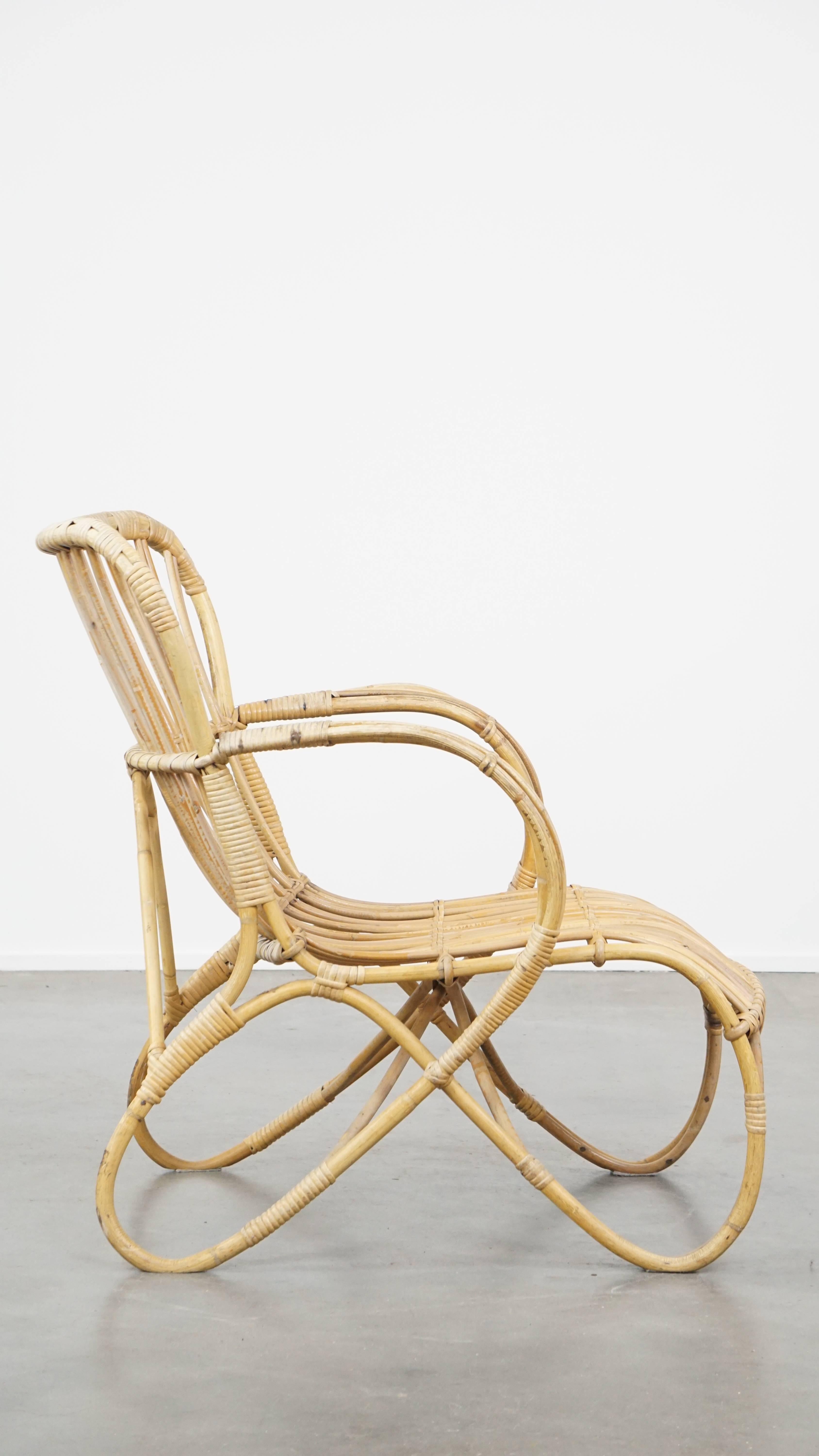 Classical Roman Vintage 1950s Dutch design rattan armchair with beautiful organic shapes For Sale