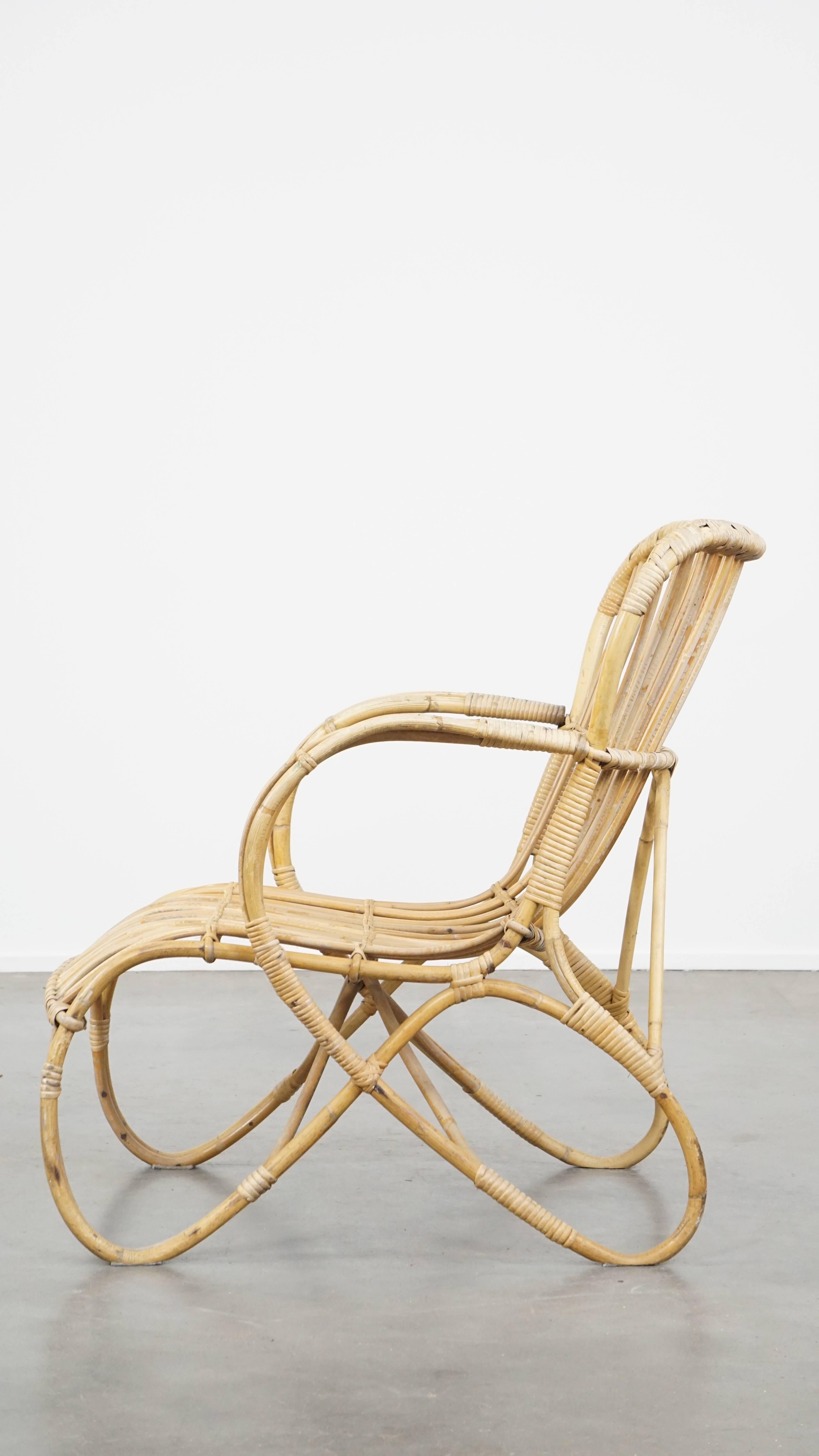 Vintage 1950s Dutch design rattan armchair with beautiful organic shapes In Good Condition For Sale In Harderwijk, NL