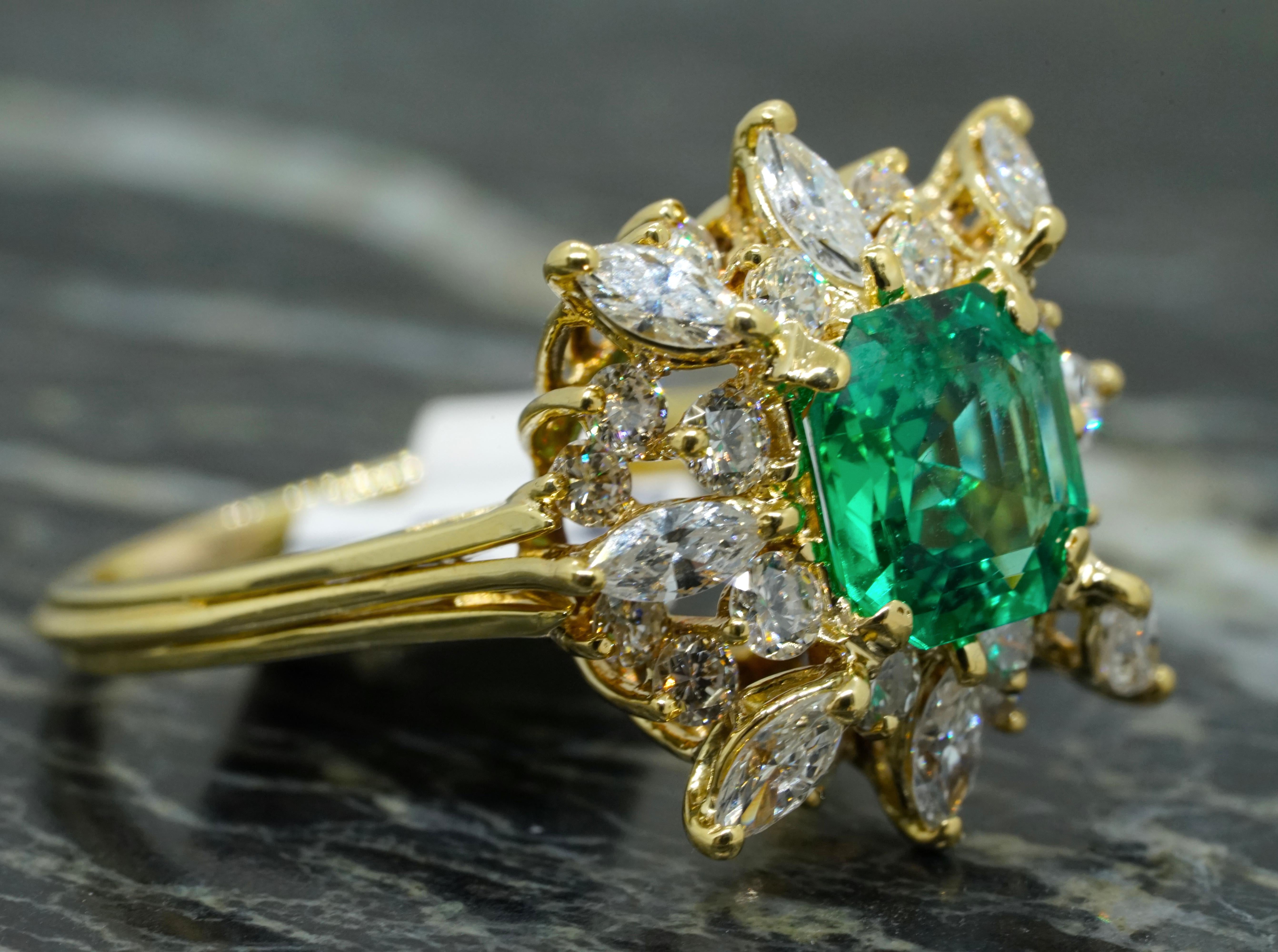 his exquisite vintage statement ring, crafted in 18K yellow gold, is a stunning showcase of elegance and craftsmanship. The ring features a vibrant 1.89 ct Natural Green Square Emerald at its center, exuding exceptional brilliance and depth. The