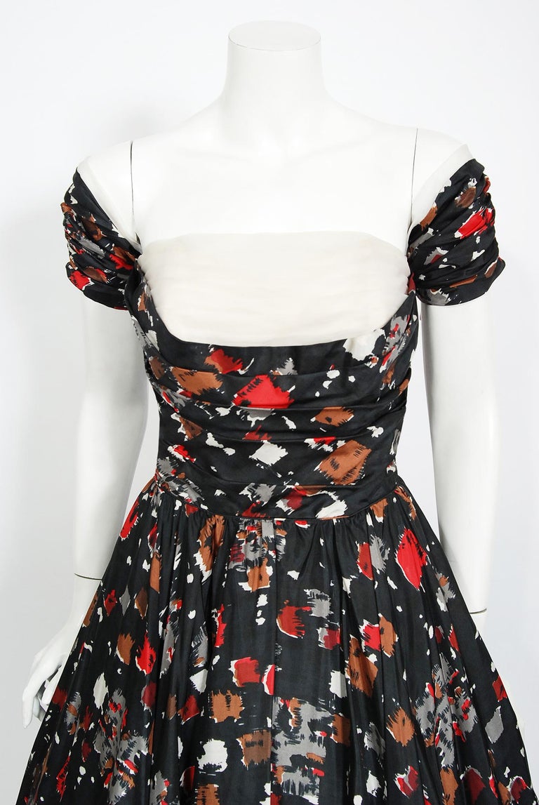 A magnificent 1950's creation by the iconic dress designer Fred Perlberg. It's hard to believe this beauty is over 60 years ago; as she looks so modernly fresh! This gorgeous garment is fashioned from atomic printed light-weight silk in the most