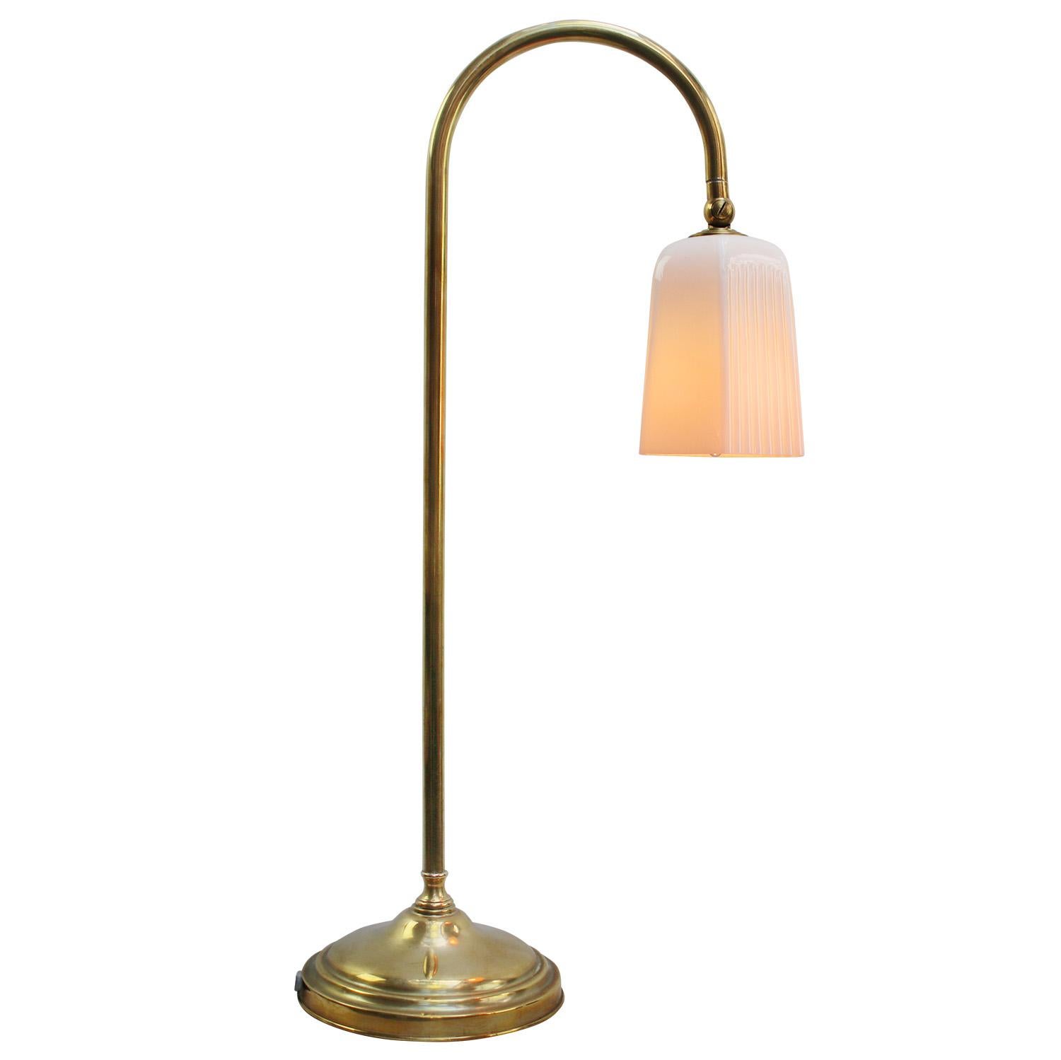 French 1950s brass desk light.
Brass base and arm with opaline glass shade.
Black cotton wire and plug.

E14 bulb holder

Also, available with US/UK plug

E14 bulb holder. Priced per individual item. All lamps have been made suitable by