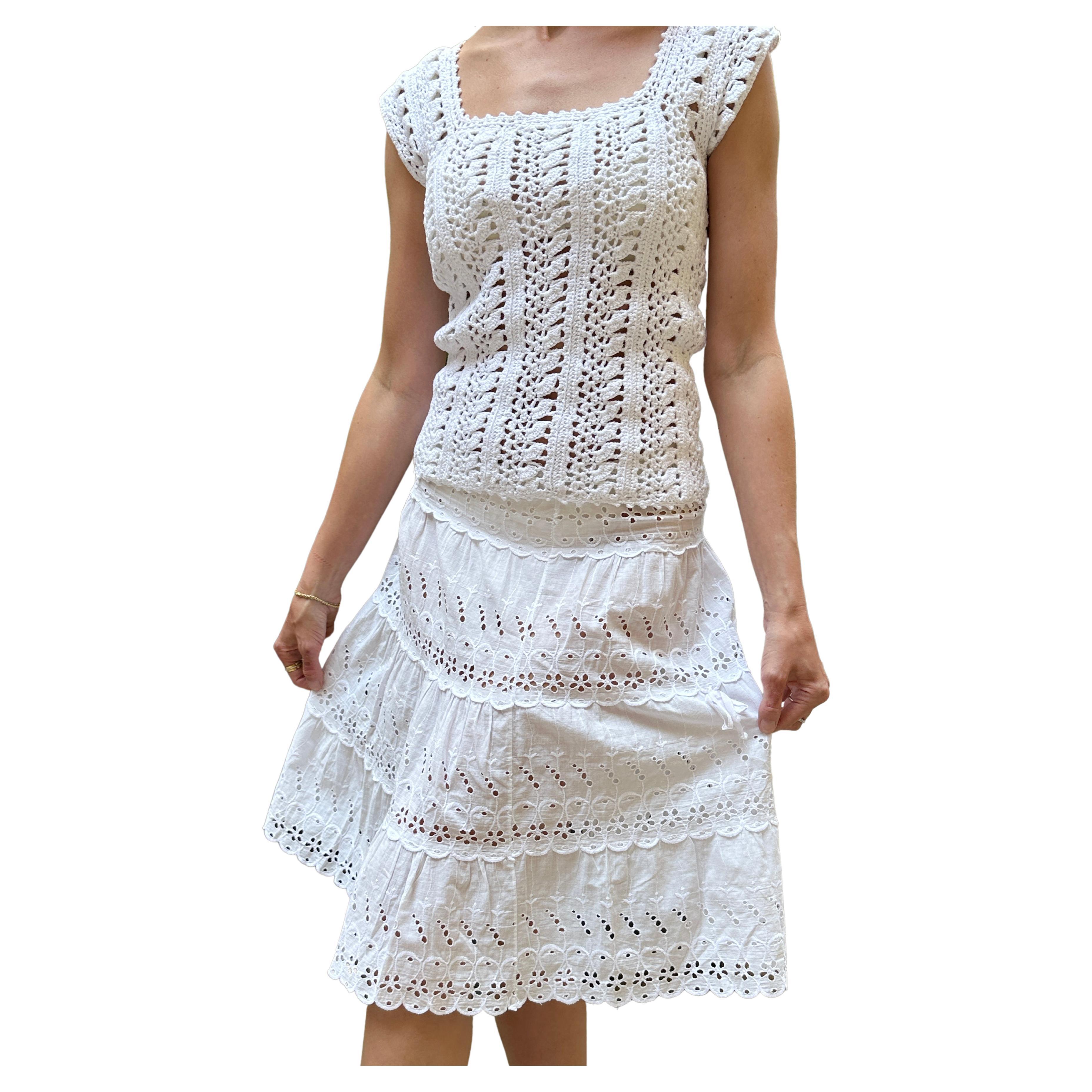 This vintage French 1950s white eyelet skirt is the sweetest thing— it reminds me of images of Brigitte Bardot in Saint Tropez in the 1950s and early 1960s. It's made entirely of four tiers of eyelet lace with scalloped details, and an A-line