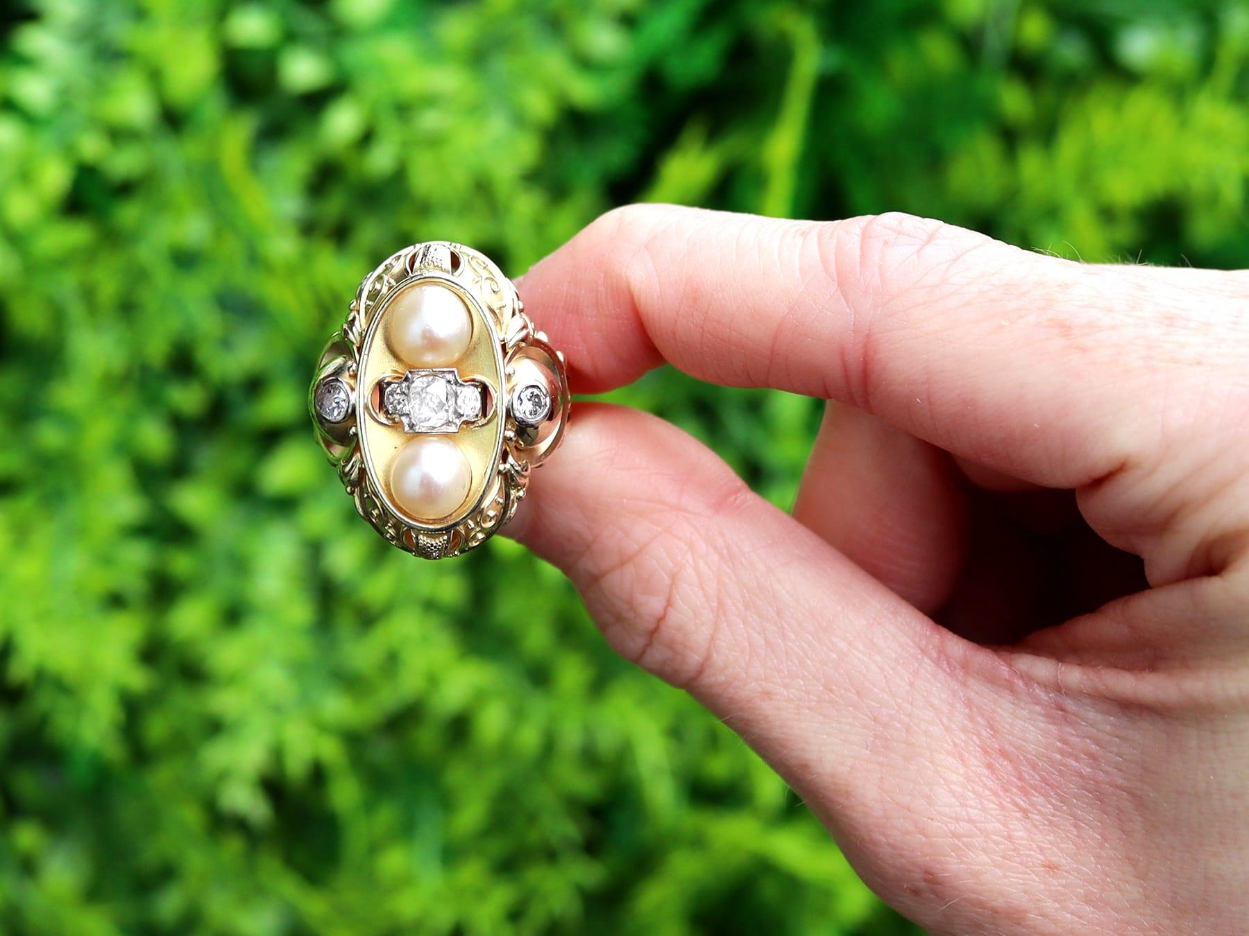 An impressive cultured pearl and 0.72 carat diamond, 14 karat yellow gold and 14 carat white gold dress ring; part of our diverse antique jewelry and estate jewelry collections.

This fine and impressive pearl and diamond ring has been crafted in