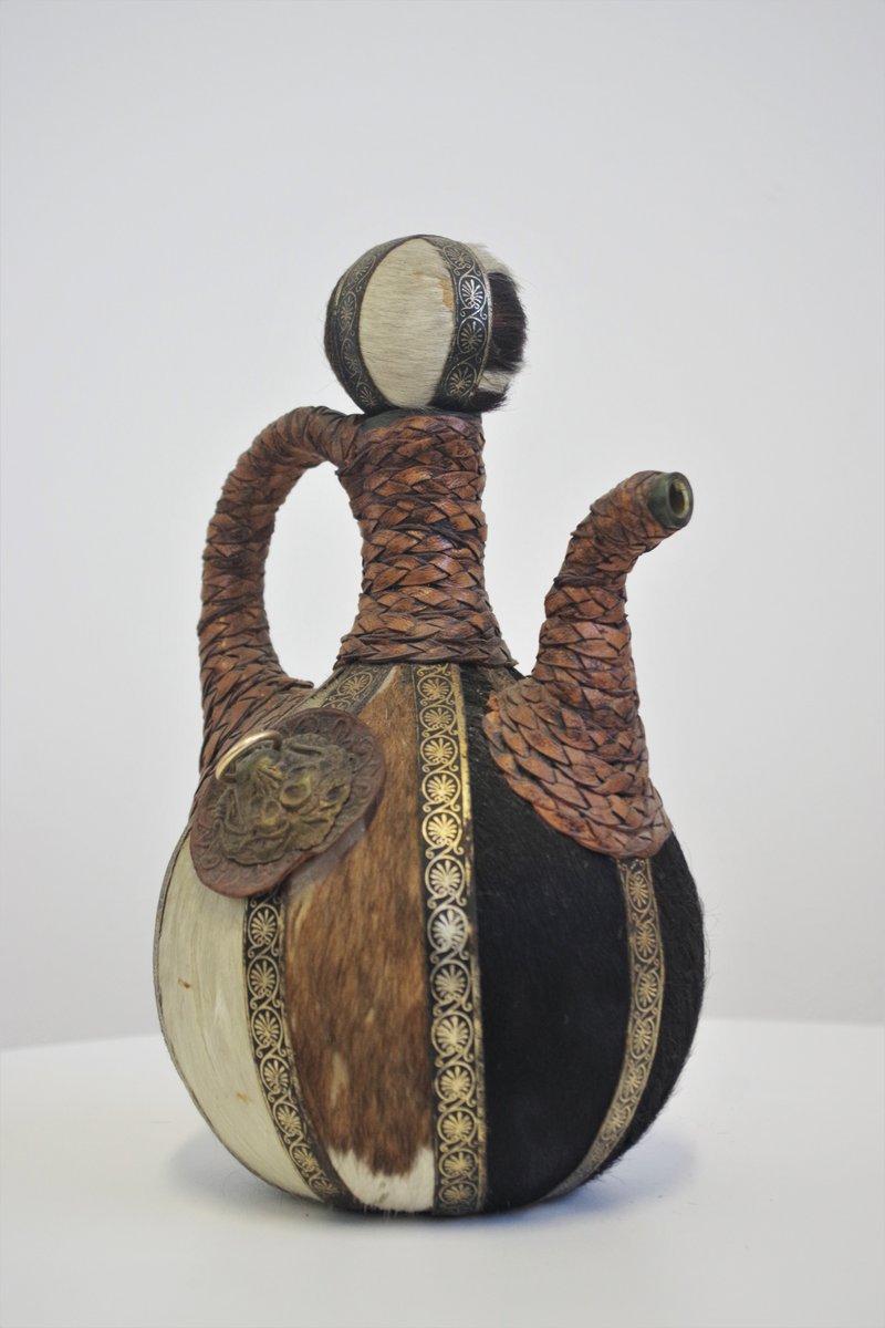 Vintage 1950s Glass Bottle - Handcrafted with Fur, Rope, and Metal Accents For Sale 5