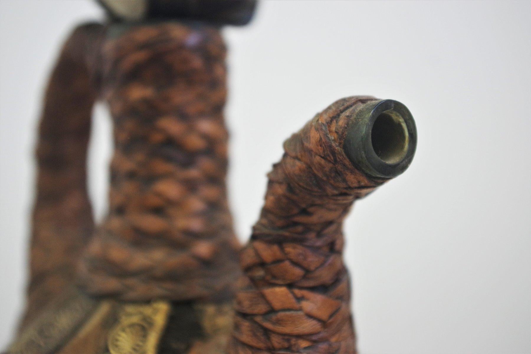 Vintage 1950s Glass Bottle - Handcrafted with Fur, Rope, and Metal Accents In Good Condition For Sale In Manzano, IT