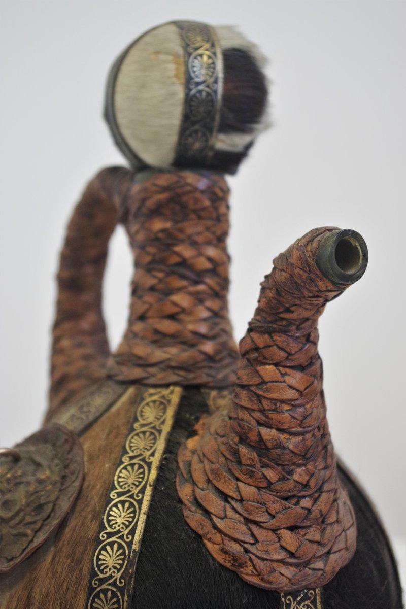 Vintage 1950s Glass Bottle - Handcrafted with Fur, Rope, and Metal Accents For Sale 3