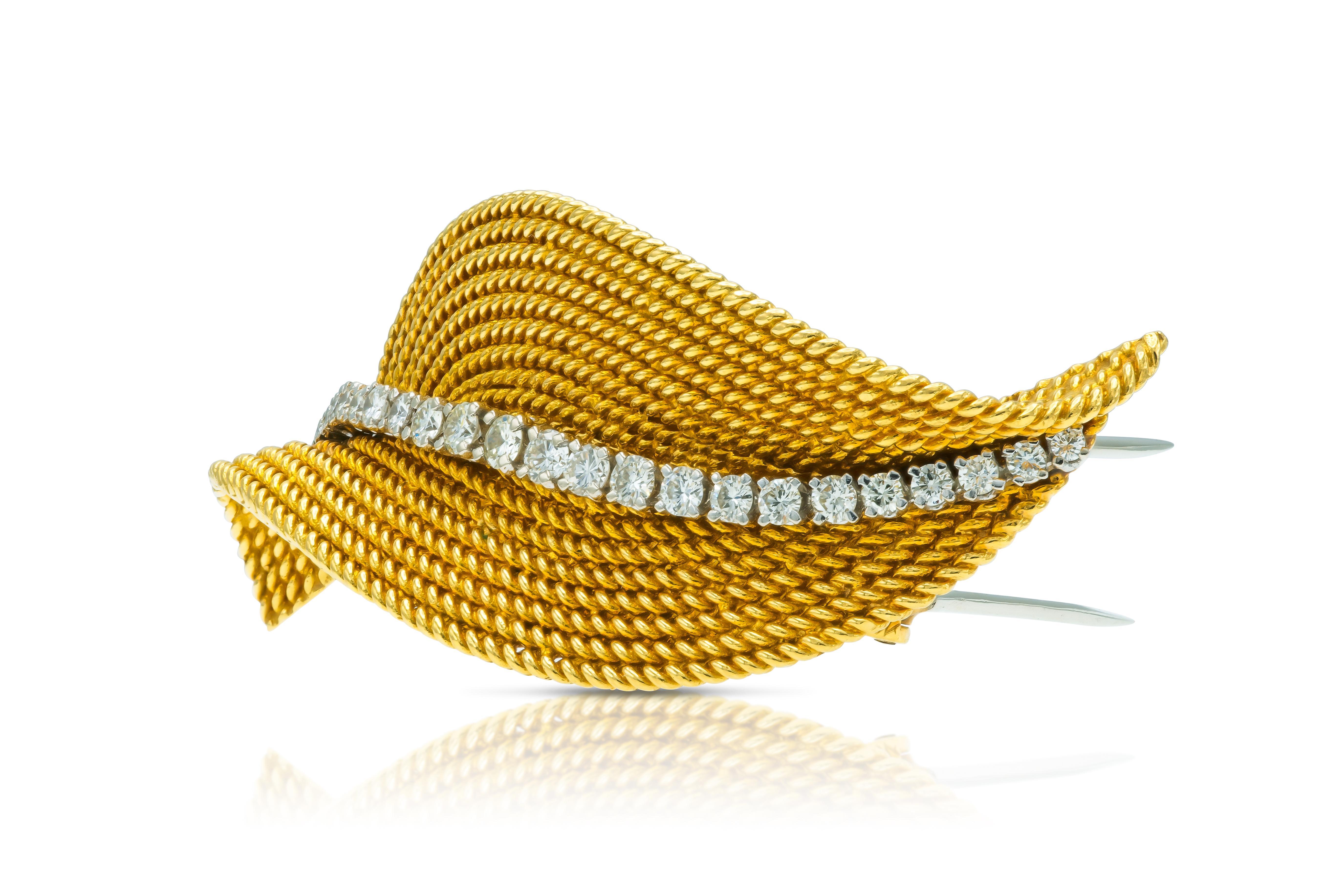Finely crafted in 18k yellow gold with 22 Round Brilliant cut Diamonds weighing approximately a total of 1.20 carats.
Circa 1950s
2 1/2 x 1 inch