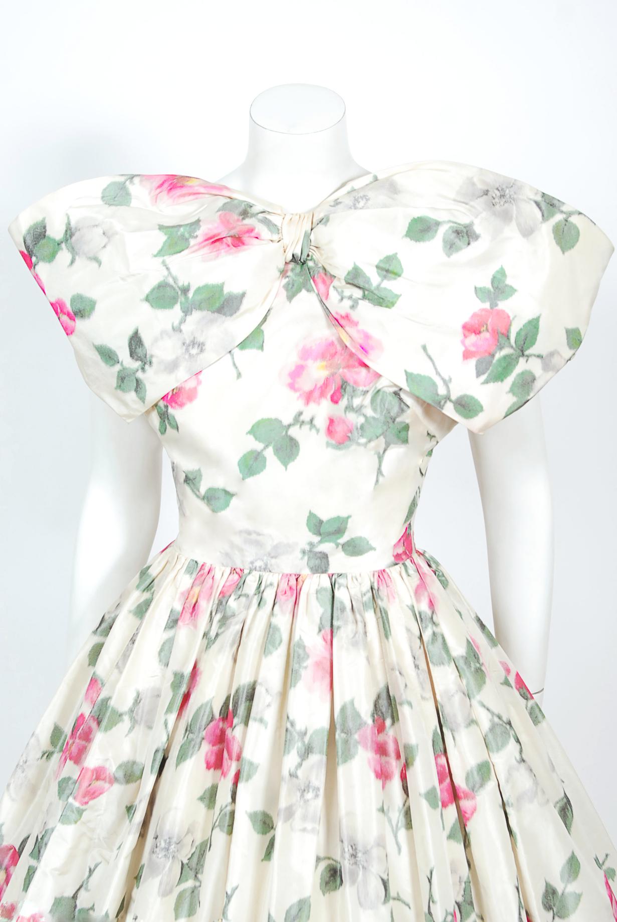 A truly breathtaking and very rare Gustave Tassell couture watercolor pink roses floral dress dating back to the late 1950's. Example of his early work are extremely hard to come by and most are only found in museum collections. Gustave Tassell was
