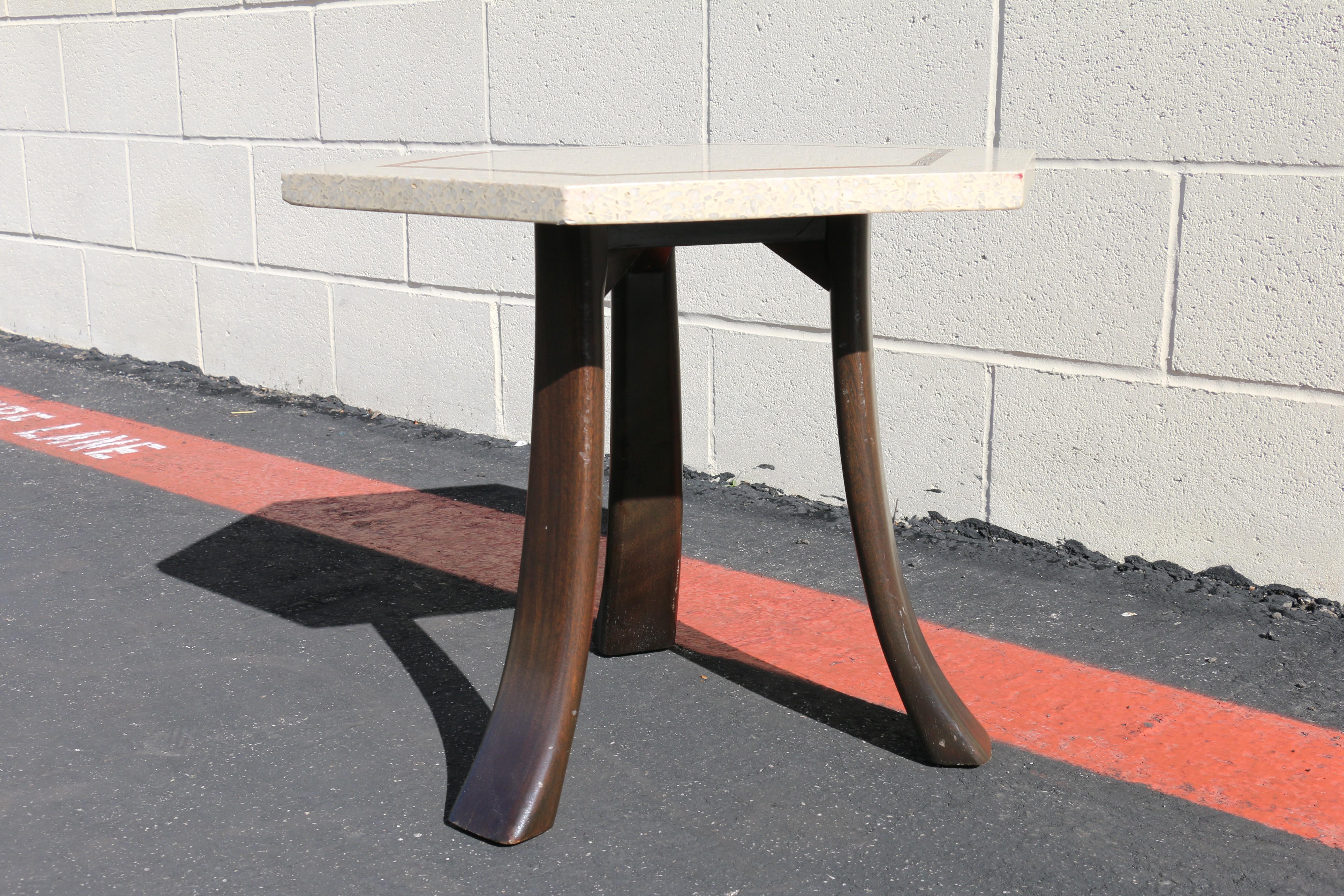 This is a beautiful vintage 1950s hexagonal side table designed by renowned mid-century modern designer Harvey Probber. The table features a striking terrazzo top with a geometric brass inlay, creating a clean, sculptural look that embodies the