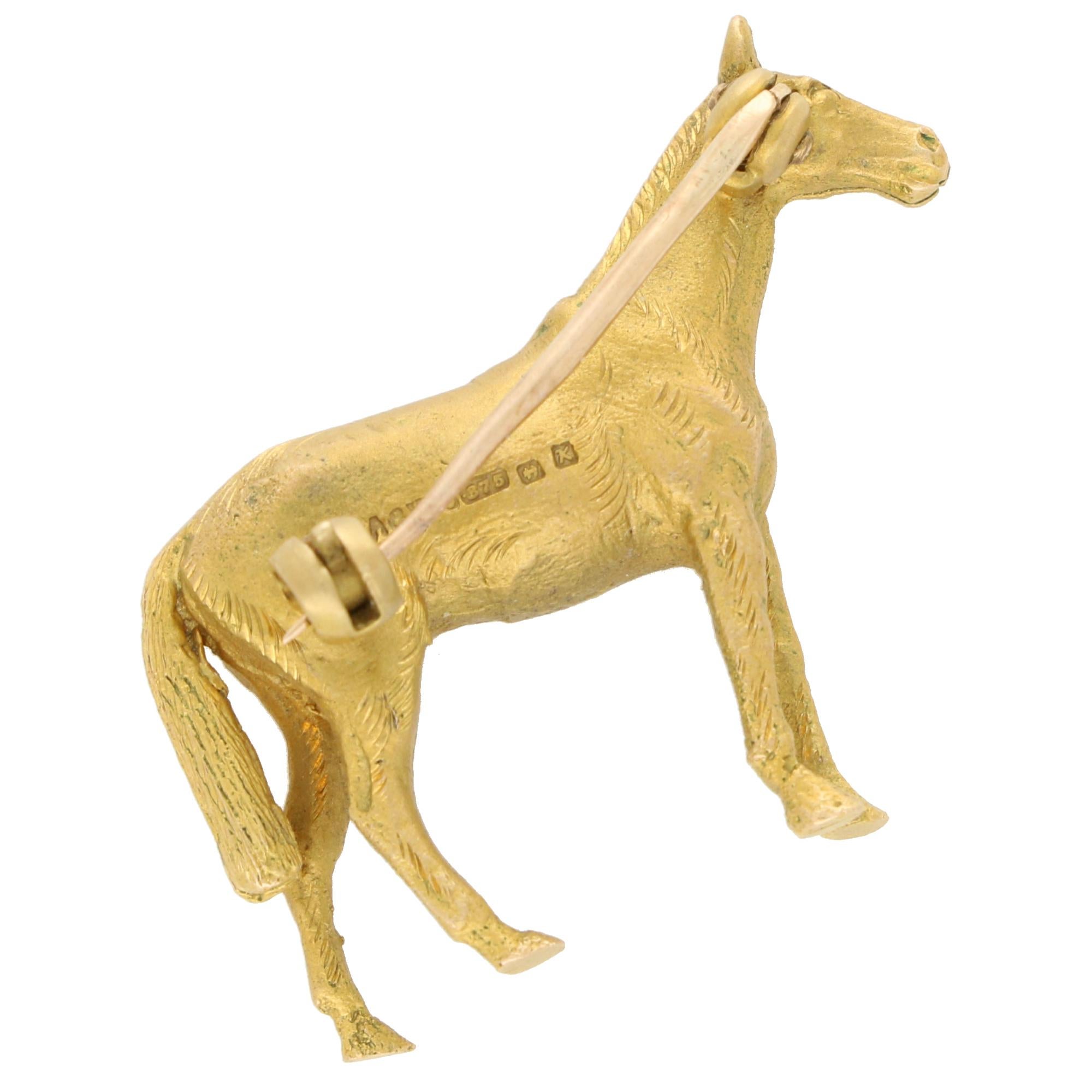 A stylish vintage 1950's horse brooch, in solid 9k yellow gold. 

The brooch depicts a standing horse, carved to depict naturalistic features. It is secured to reverse with a pin and roller clasp fitting. 

Due to the size, this brooch would look