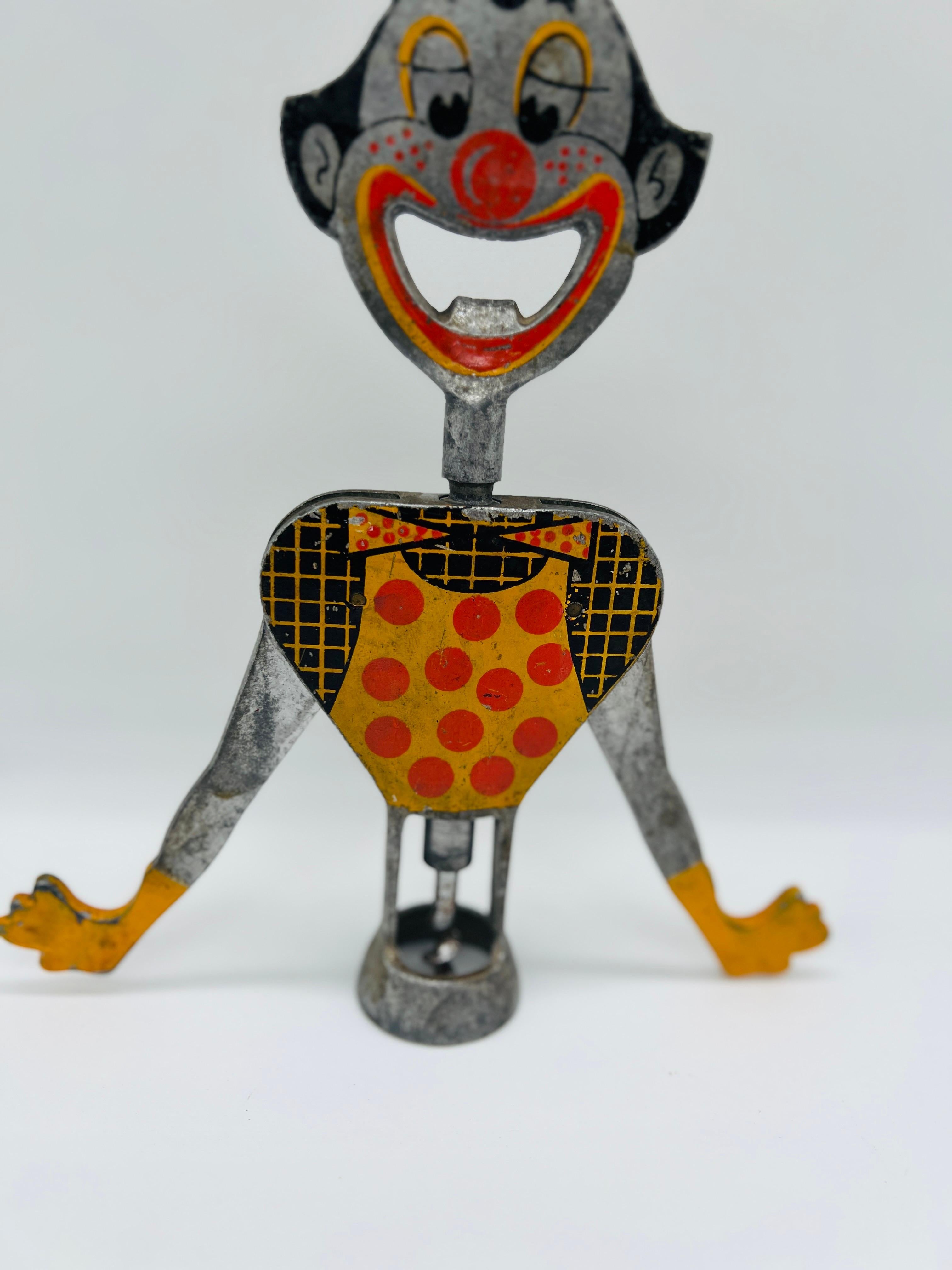Based on Carlo Gemelli''s double lever design. A great conversation piece, it is yellow, black, and red painted on aluminum. The back of his body has a variety of drinking toasts in several languages. A great conversation piece for any vintage or
