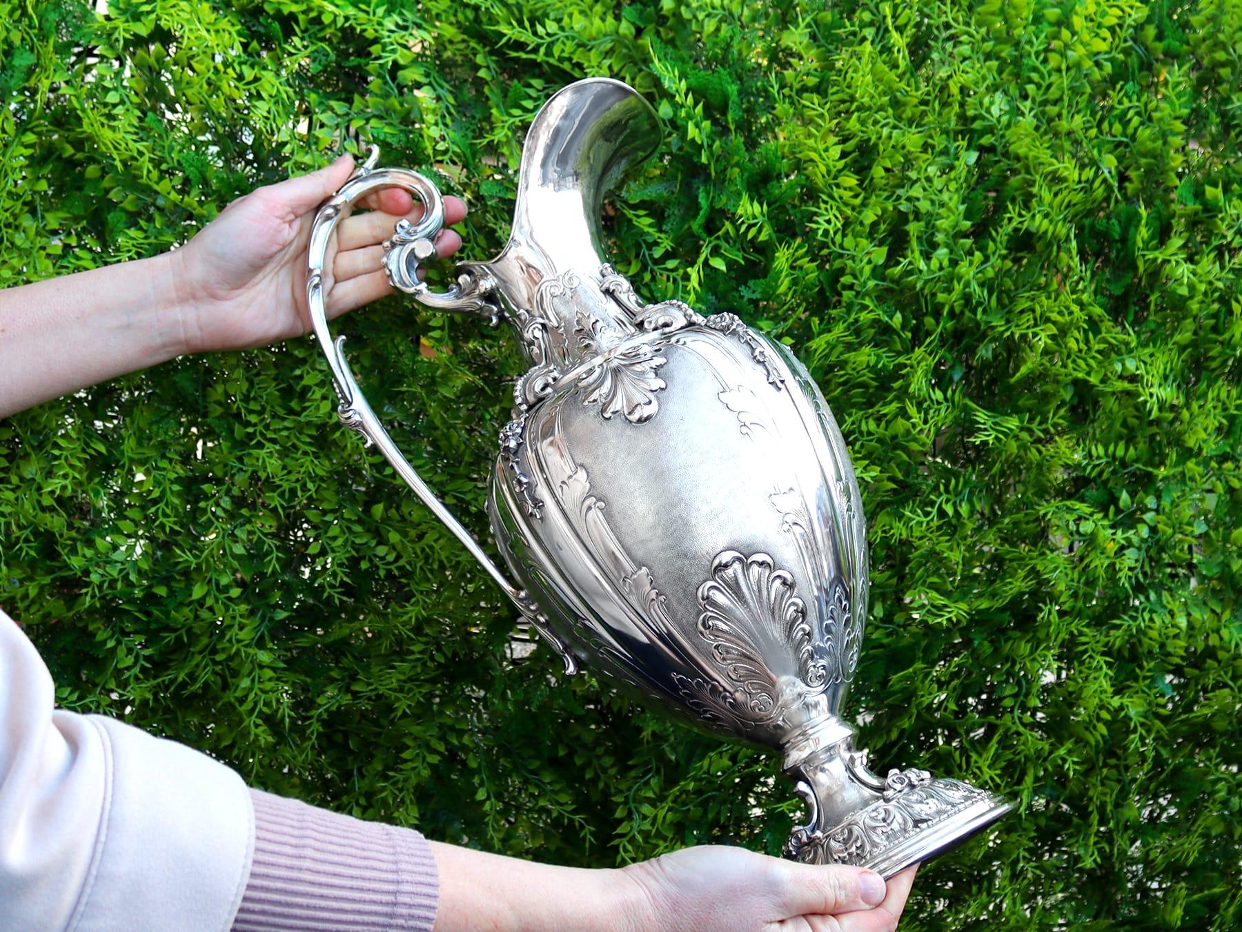 An exceptional, fine and impressive, large vintage Italian silver wine ewer and presentation plate, part of our wine and drinks related silverware collection.

This exceptional and large antique Italian silver ewer has a rounded ovoid shaped form
