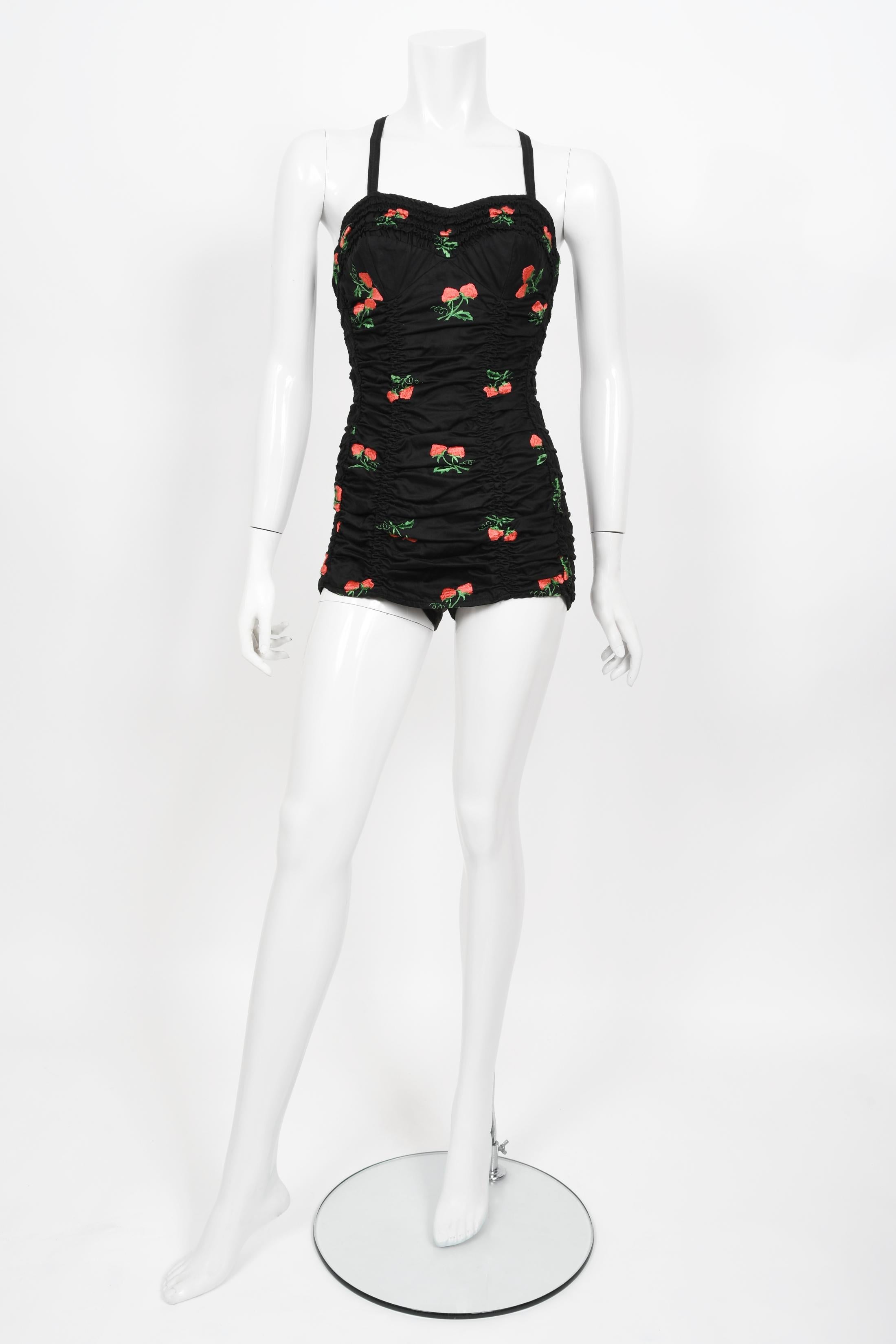 Words can not describe how beautiful this 1950's Jantzen swimsuit ensemble is. The bathing suit is made from a high-grade ruched stretch polished cotton blend fabric with adorable strawberries embroidered throughout. It is cut in that classic pin-up