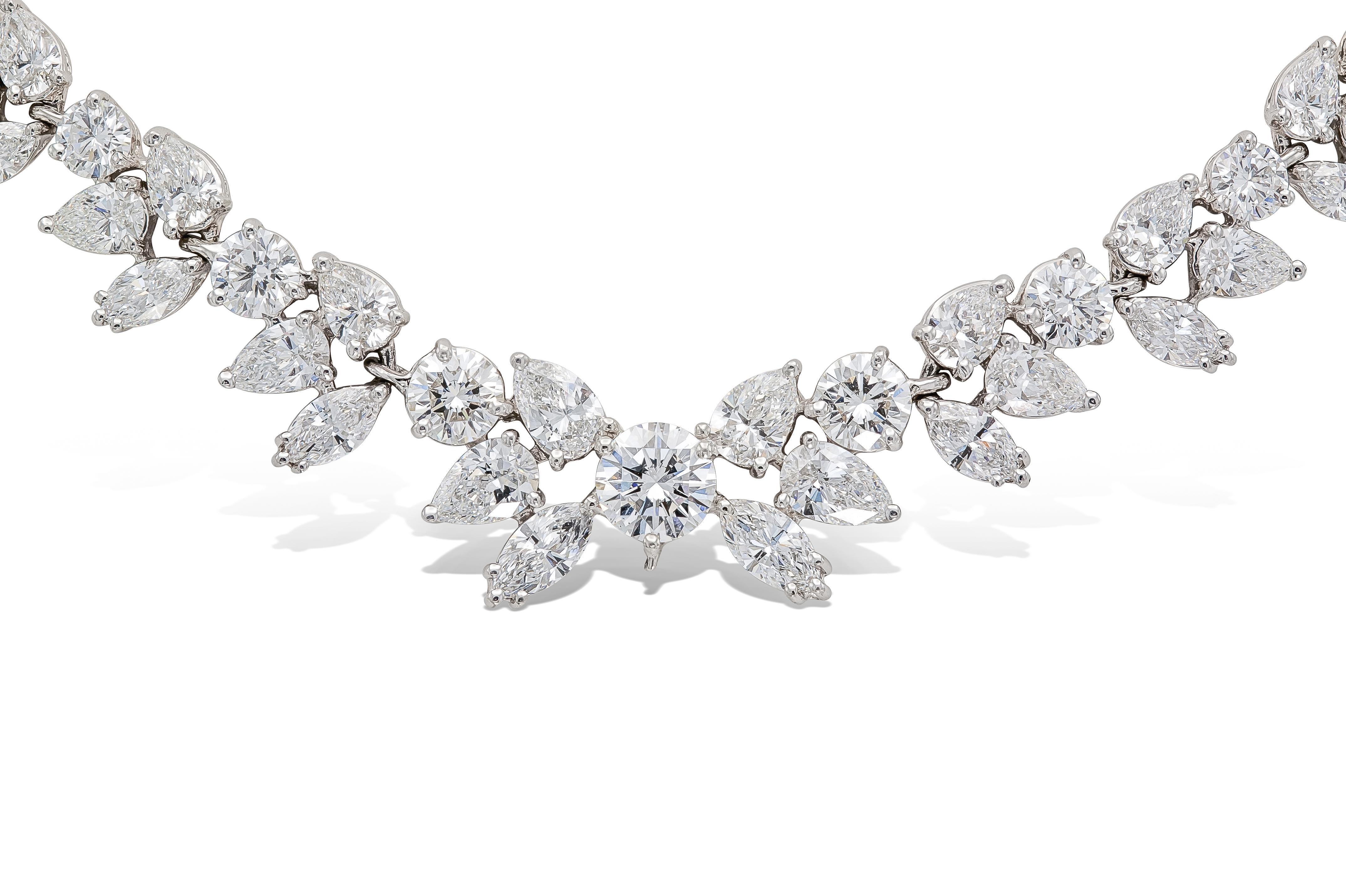Finely crafted in platinum with a GIA certified Round Brilliant cut Diamond at the center weighing 1.57 carats, D color, VS2 clarity, GIA #12757823.
The necklace features Pear-Shaped, Marquise, and smaller Round Brilliant cut Diamonds weighing a