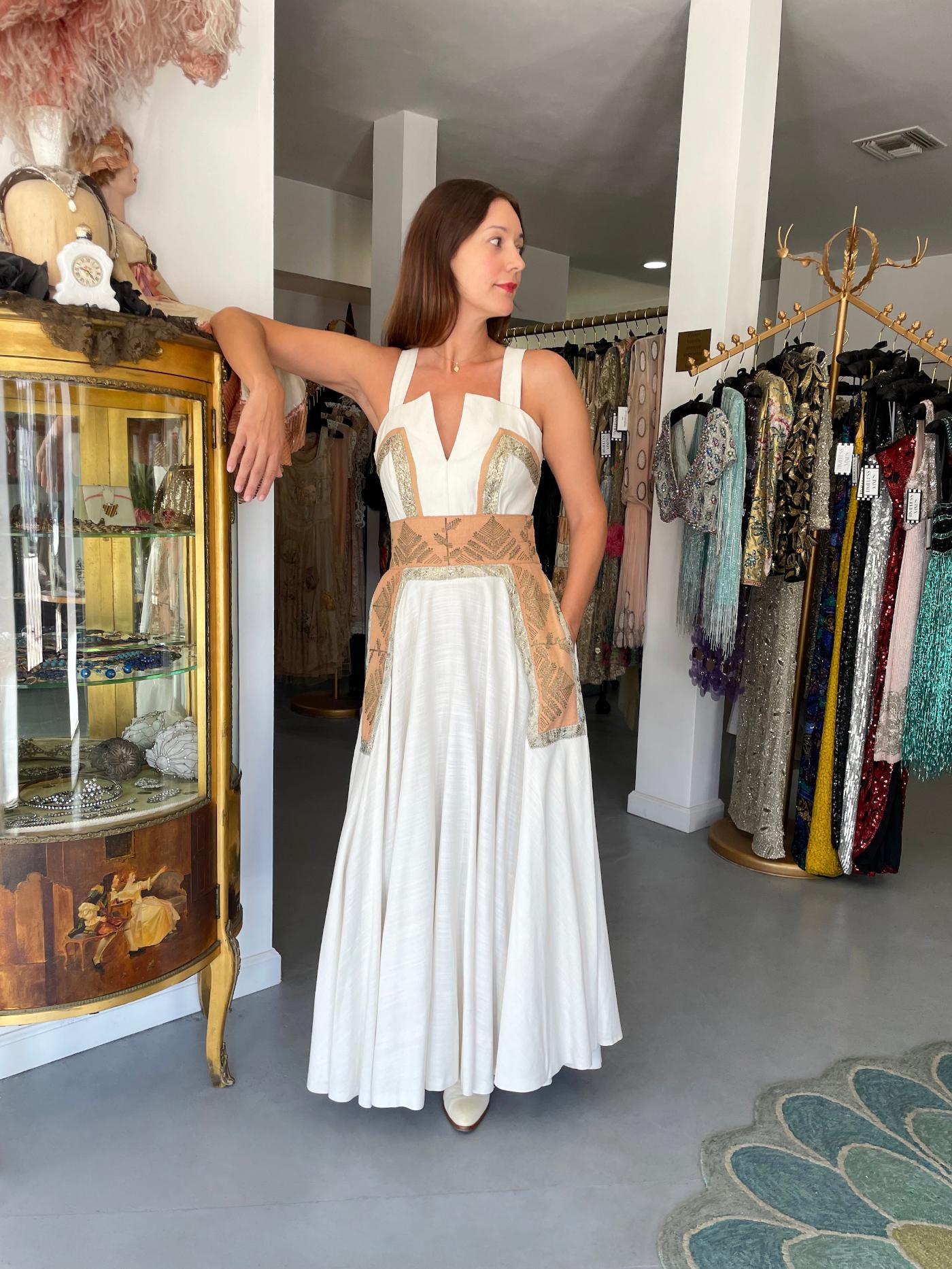 An exceptionally beautiful and incredibly rare Jeanne Lanvin Castillo couture metallic accented ivory white gown ensemble dating back to the mid 1950's. Castillo was invited by Jeanne Lanvin's daughter to design for her mother's firm in Paris, with