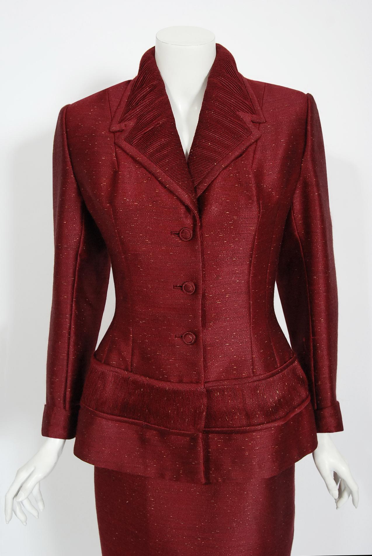 Gorgeous metallic merlot-red silk Lilli Ann suit dating back to their 1954 collection. Lilli Ann was started in San Francisco in 1933 by Adolph Schuman, naming his company for his wife, Lillian. The company became known for their beautiful,