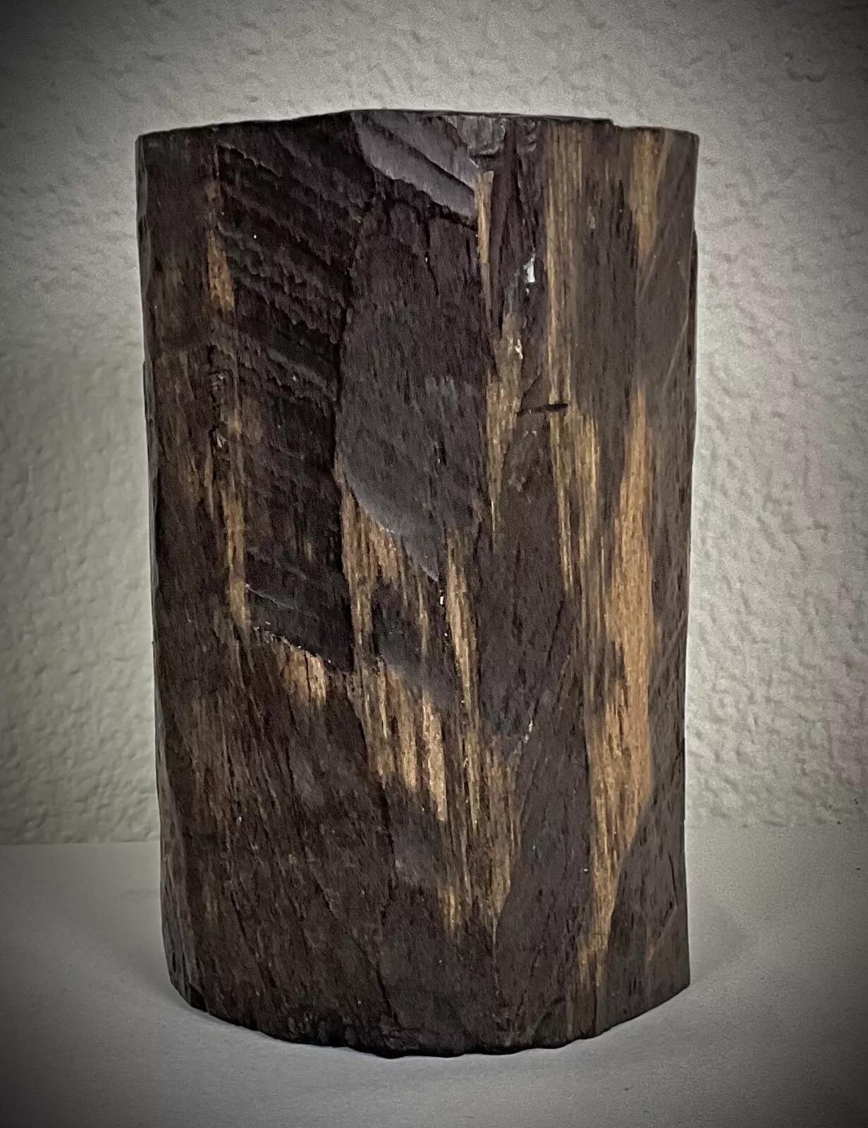 This is a vintage Malagasy hand-carved sculpture from the 1950s-1960s, depicting a nude woman in a graceful, naturalistic pose. Expertly crafted from solid ebony wood, this piece showcases the fine artistry and traditional craftsmanship of