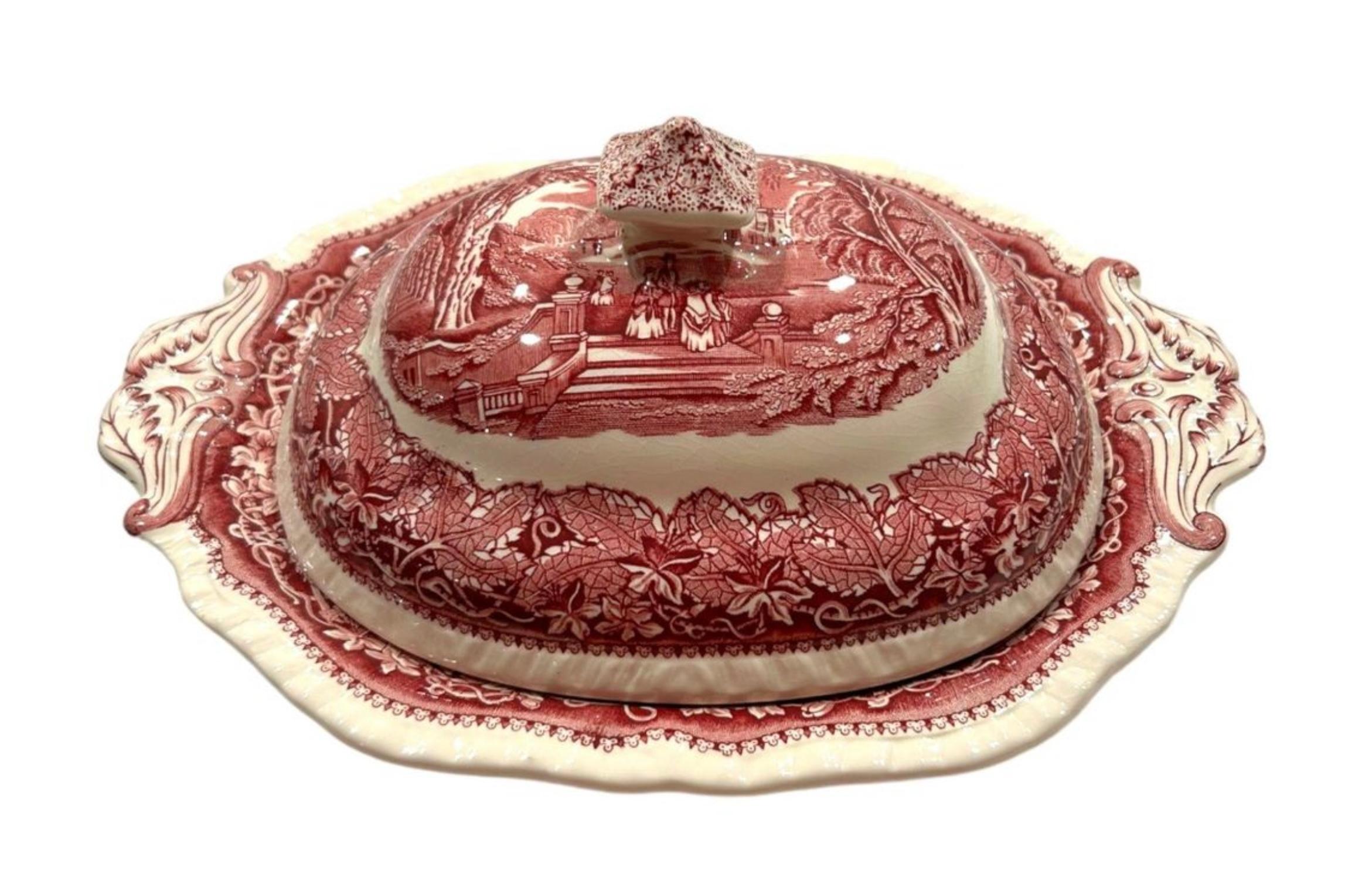 This 1950’s Mason’s oval serving bowl with lid is a beautiful addition to a collection.  Featuring red “Vista” ironstone transferware, this bowl is perfect for serving meals or displaying as decorative cookware.  Made by the renowned Mason’s brand,
