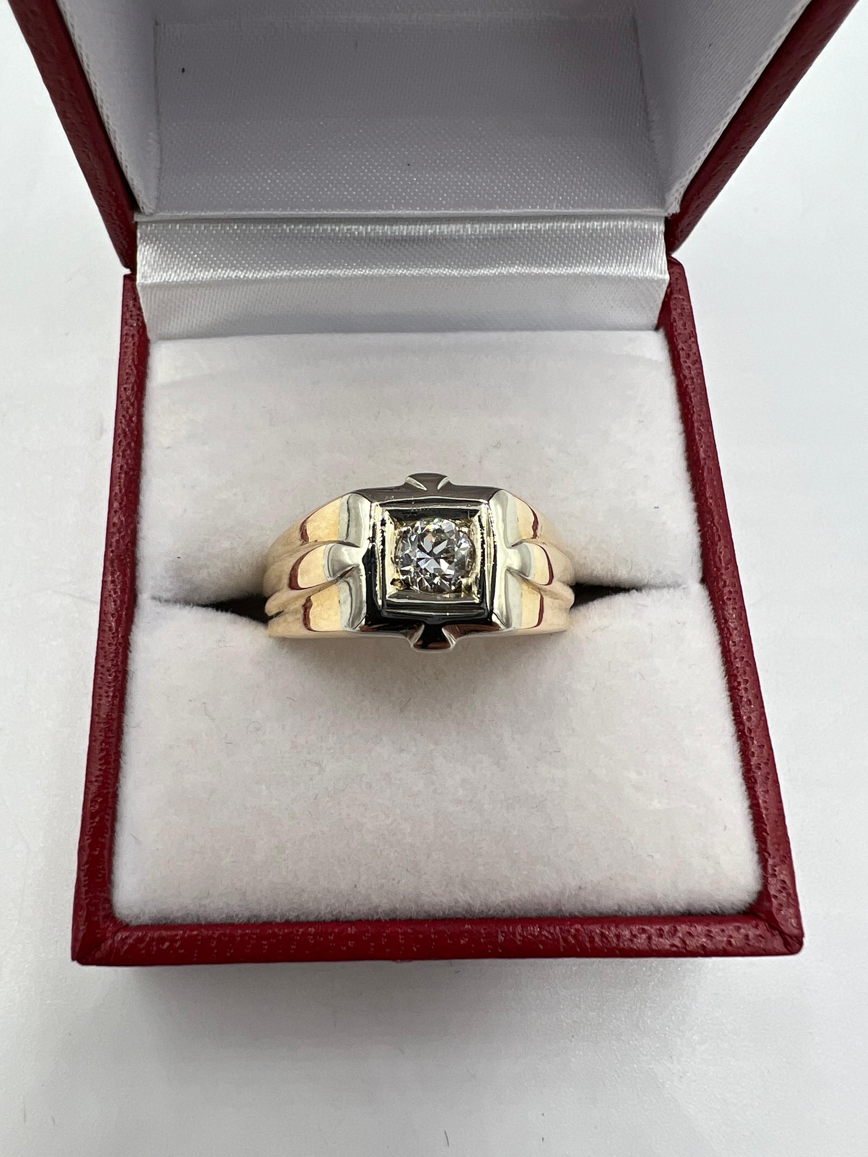 Vintage 1950s mens diamond two-tone gold solitaire ring.

The 1950s solitaire diamond two-tone gold mens ring is an iconic piece of jewelry from this period.  This ring represents the epitome of mid-century design, with its sleek lines and timeless
