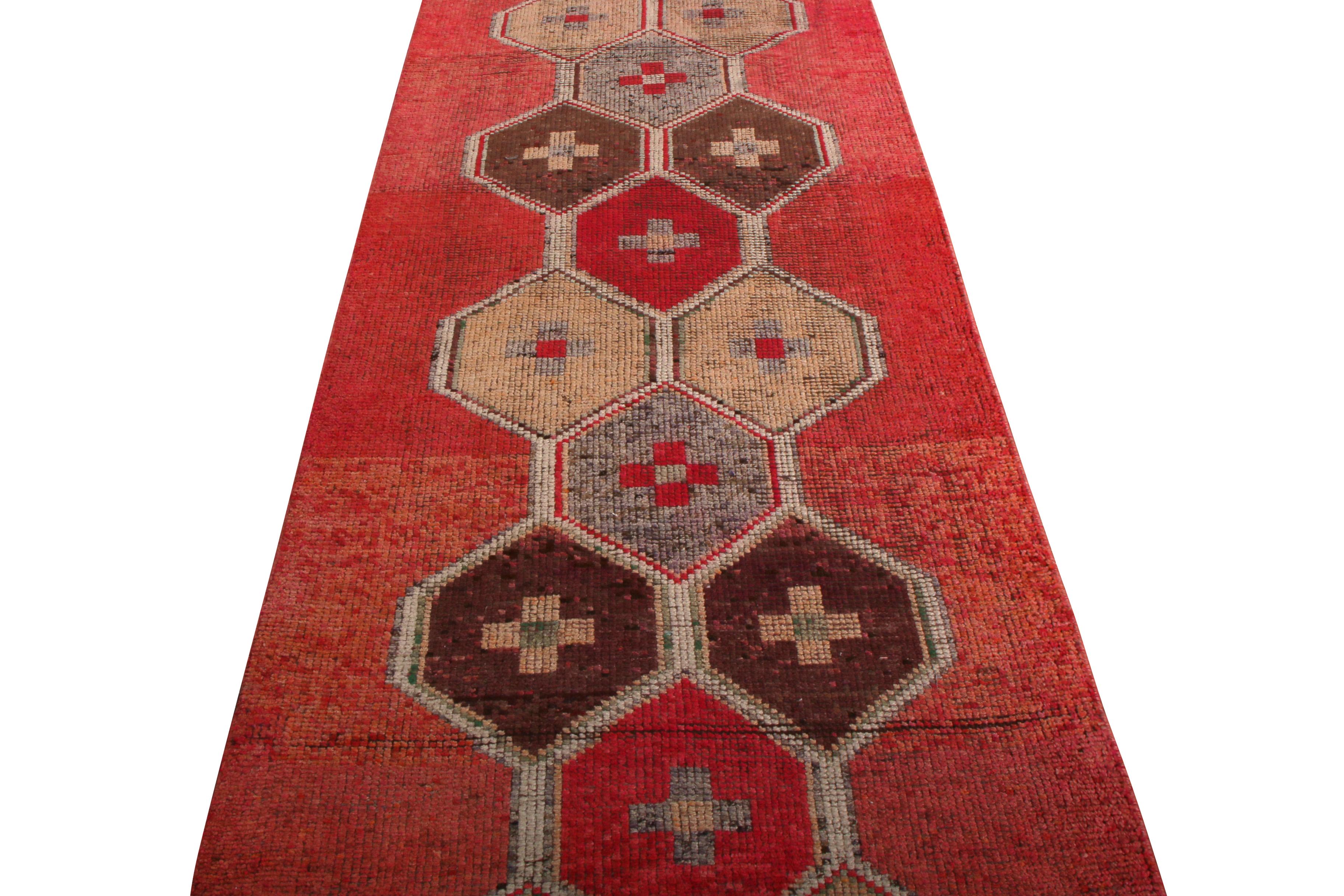 Made with handwoven wool originating from Turkey between 1950-1960, this vintage midcentury Kilim runner represents one of the most distinct new additions to our 1950s rug lines, sporting a meticulous geometric embroidery pattern against a