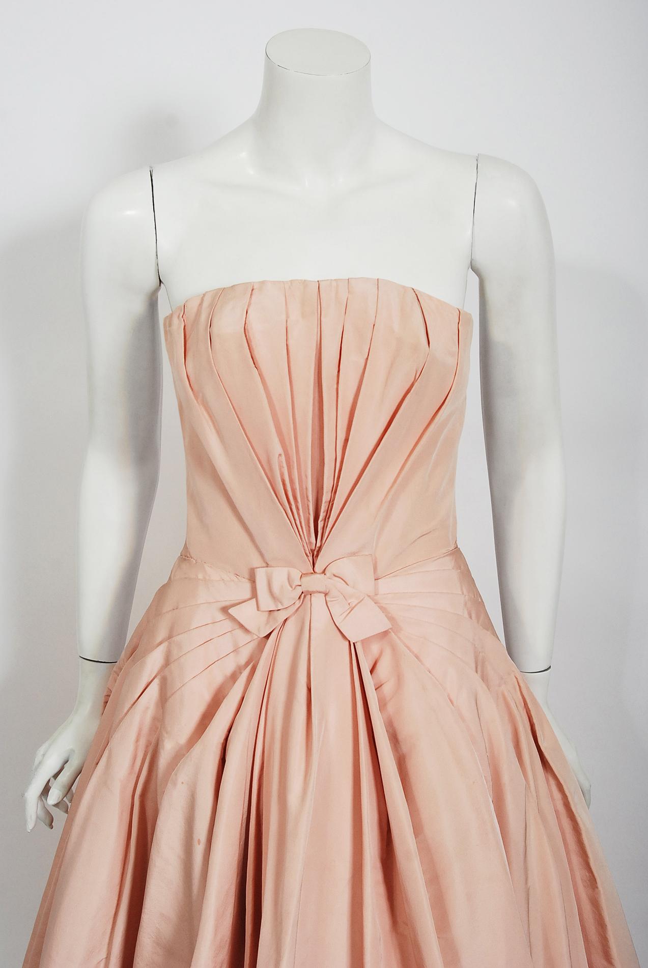 A gorgeous mid-century formal gown by the nearly impossible to find Italian couturier Mingolini Guggenheim. As you can see, this designer was heavily influenced by Christian Dior and any French inspired fashion pieces from this period are true
