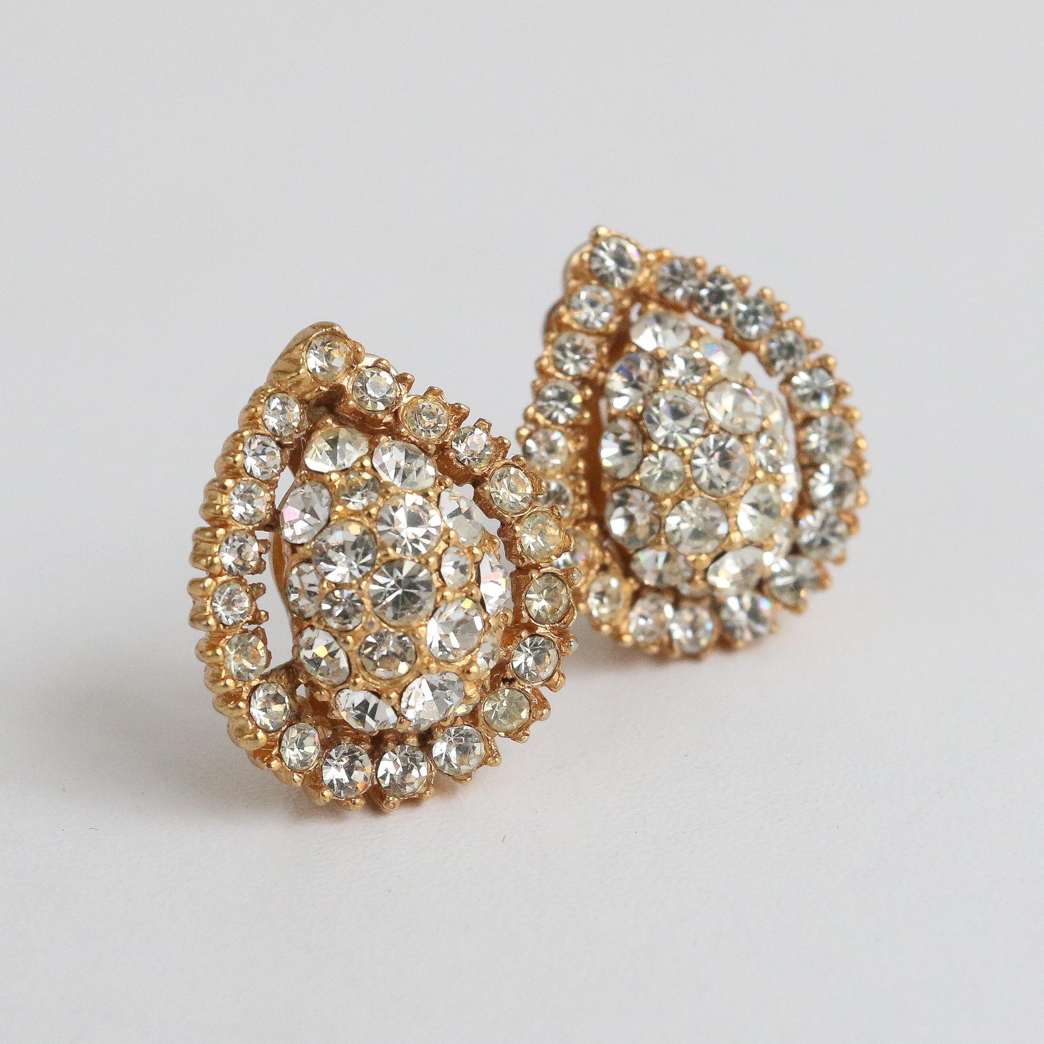 Vintage 1950's Mitchel Maer for Christian Dior Rhinestone Clip-on Earrings

This wonderful pair of late 1950's clip on earrings, by Mitchel Maer for Christian Dior are a rare set to behold and never again find.
Made up of set glass rhinestones, in a