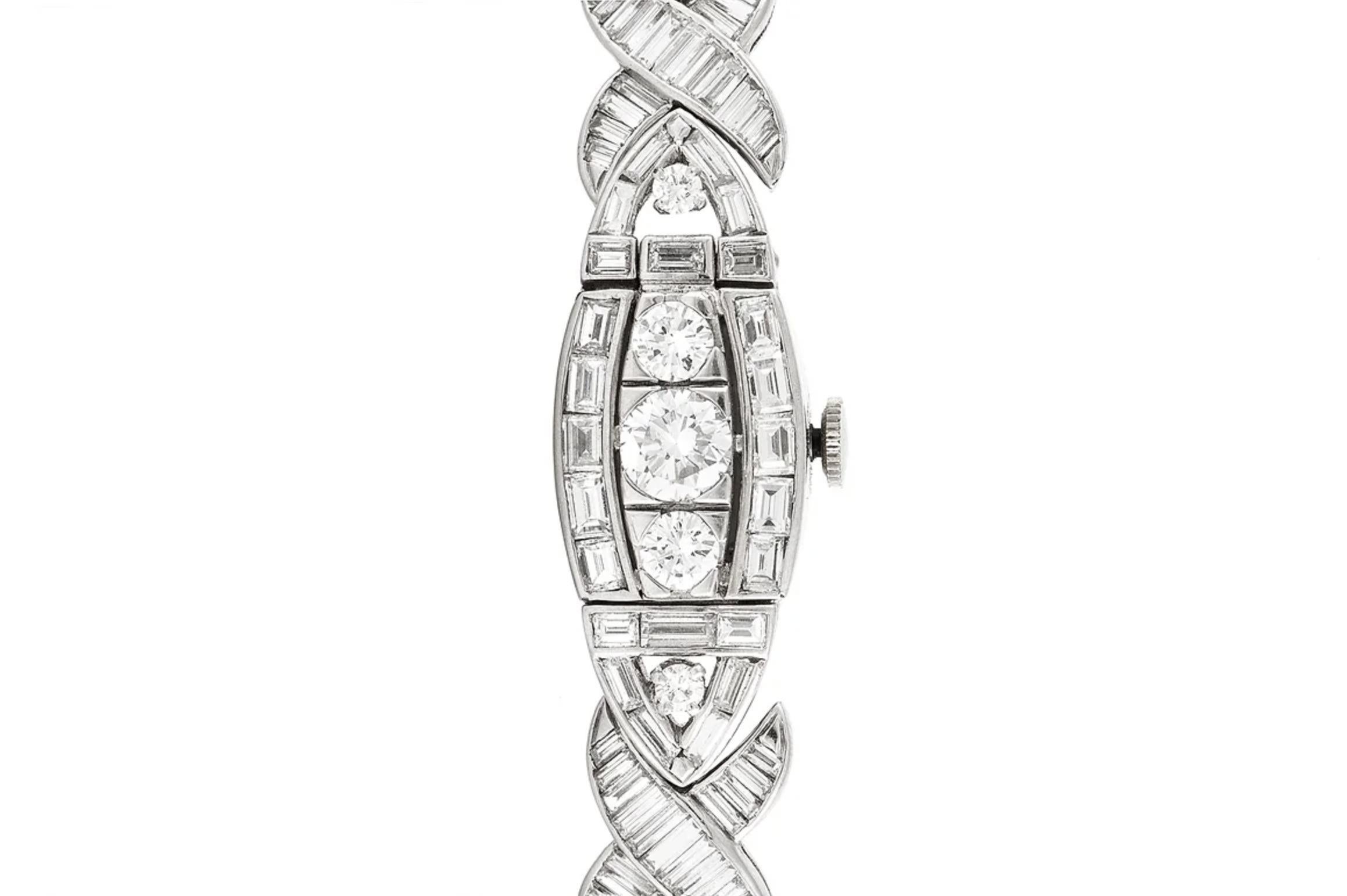 Finely crafted in platinum with Round Brilliant and Baguette cut Diamonds weighing approximately a total of 14.00 carats.
Signed by Movado
Circa 1950s
Size 7 inches