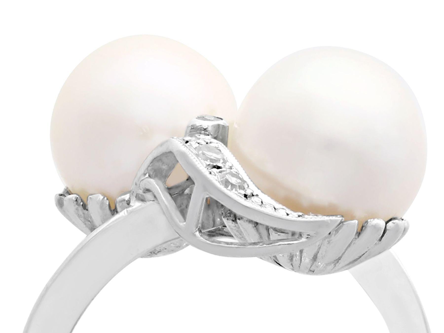 A fine and impressive cultured pearl and 0.12 carat diamond, 10 karat white gold twist design cocktail ring; part of our diverse jewelry and estate jewelry collections.

This fine and impressive pearl and diamond cocktail ring has been crafted in