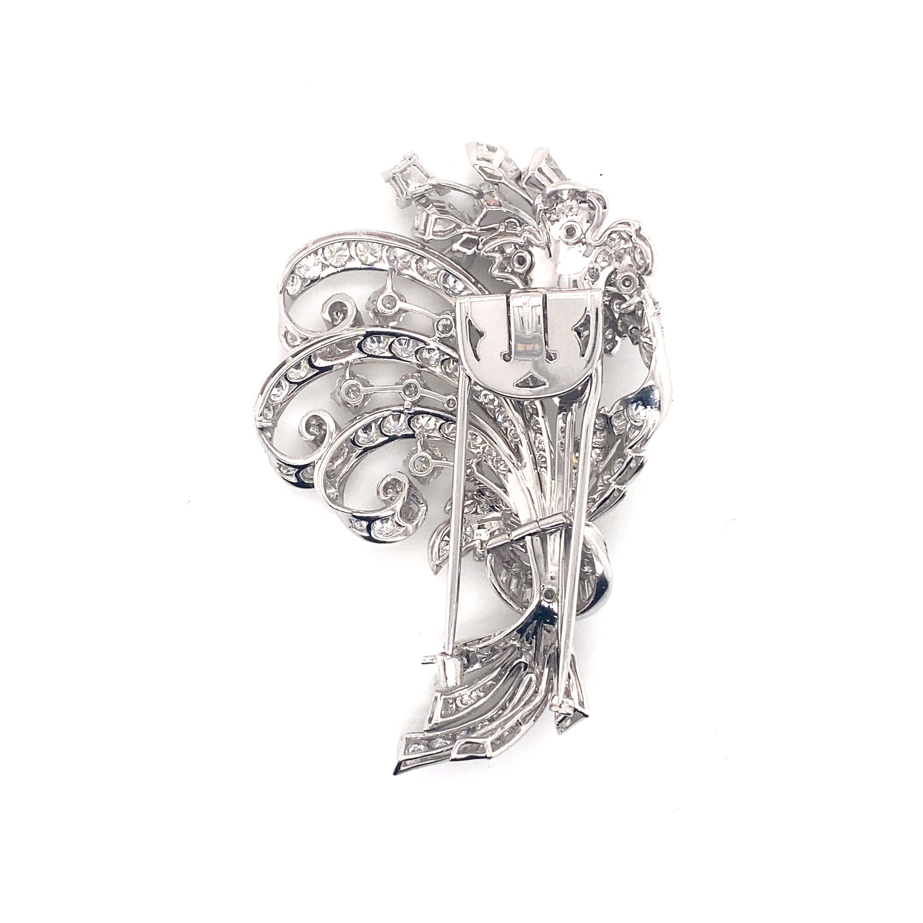 Vintage 1950’s Platinum Diamond Flower Bouquet Pin 9.70ct - The pin contains 5 fancy kite shape diamonds and 1 marquise diamond with a total approximate weight of 1.50ct, 10 baguette diamonds approximately .70ct, and 12 round brilliant diamonds set