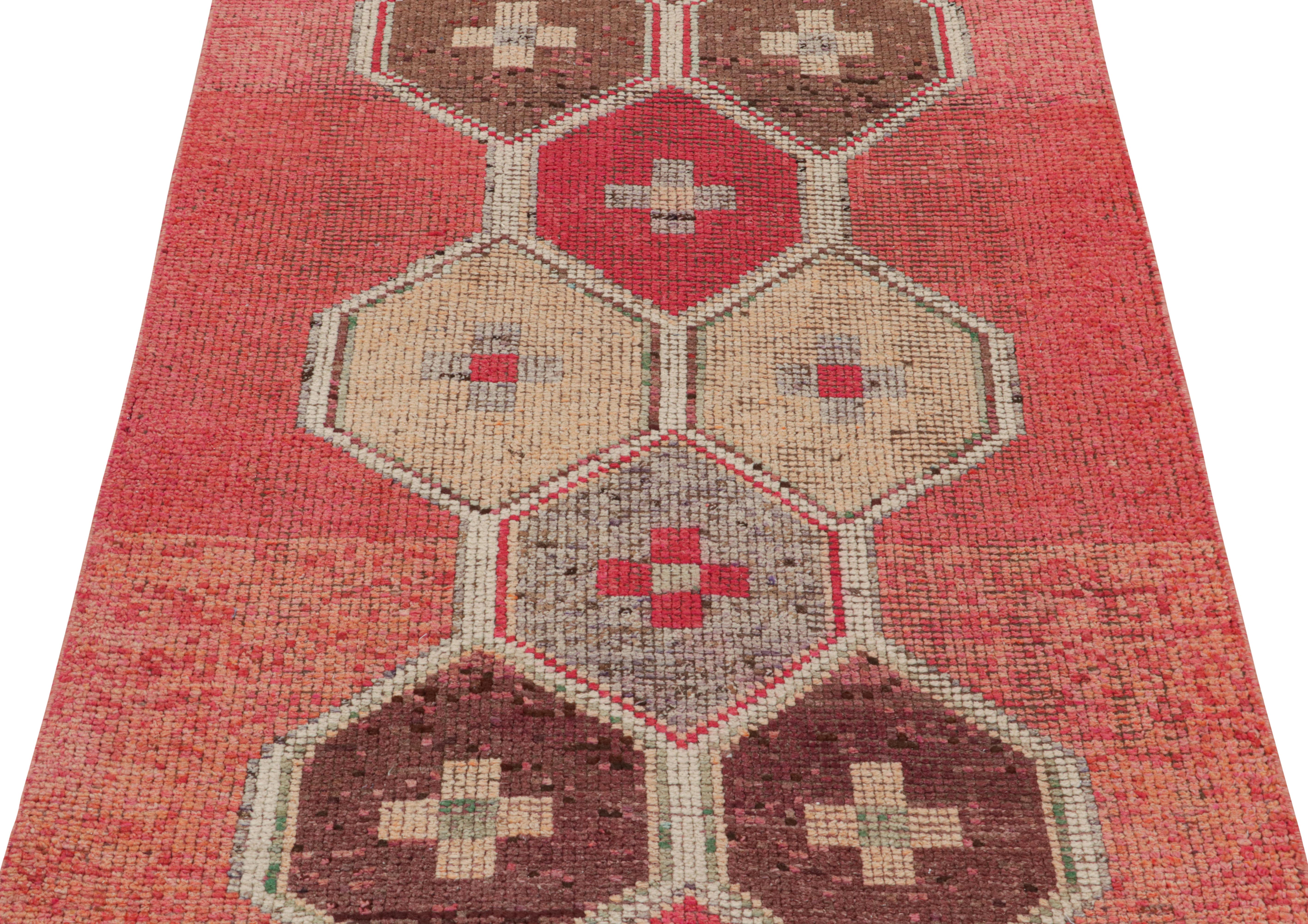 Made with handwoven wool originating from Turkey between 1950-1960, this vintage midcentury Kilim runner represents one of the most distinct new additions to our 1950s rug lines, sporting a meticulous geometric embroidery pattern against a