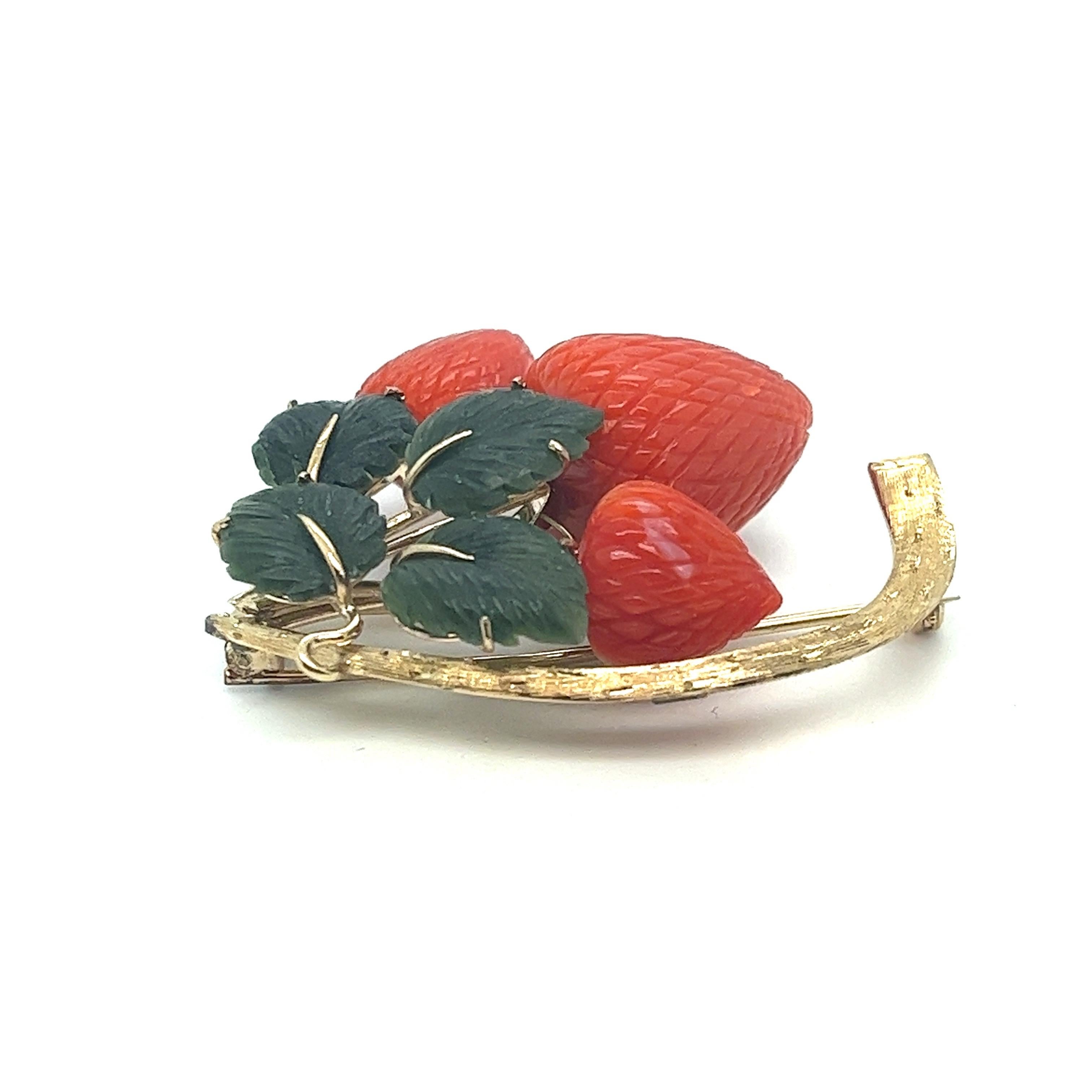 Vintage 1950s Retro Brooch with Natural Coral Strawberries and Jade Nephrite Leaves

Elevate your style with a piece of history that exudes the charm and elegance of the 1950s. This exquisite vintage brooch, crafted in 14kt yellow gold, showcases