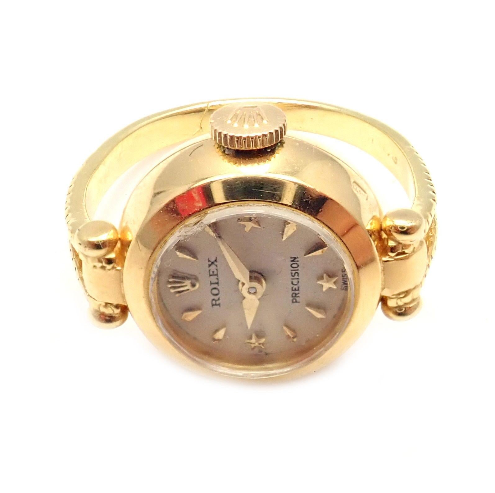 18k Yellow Gold Vintage Ring Watch by Rolex. 
Details: 
Ring Size: 4
Weight: 8.5 grams
Case Top: 15mm x 19.5mm
Movement: Manual cal. 280 17J Movement
Stamped Hallmarks: Dial: Rolex Precision
Case Back: Rolex Logo, 463137
Crown: Rolex Logo
Also: