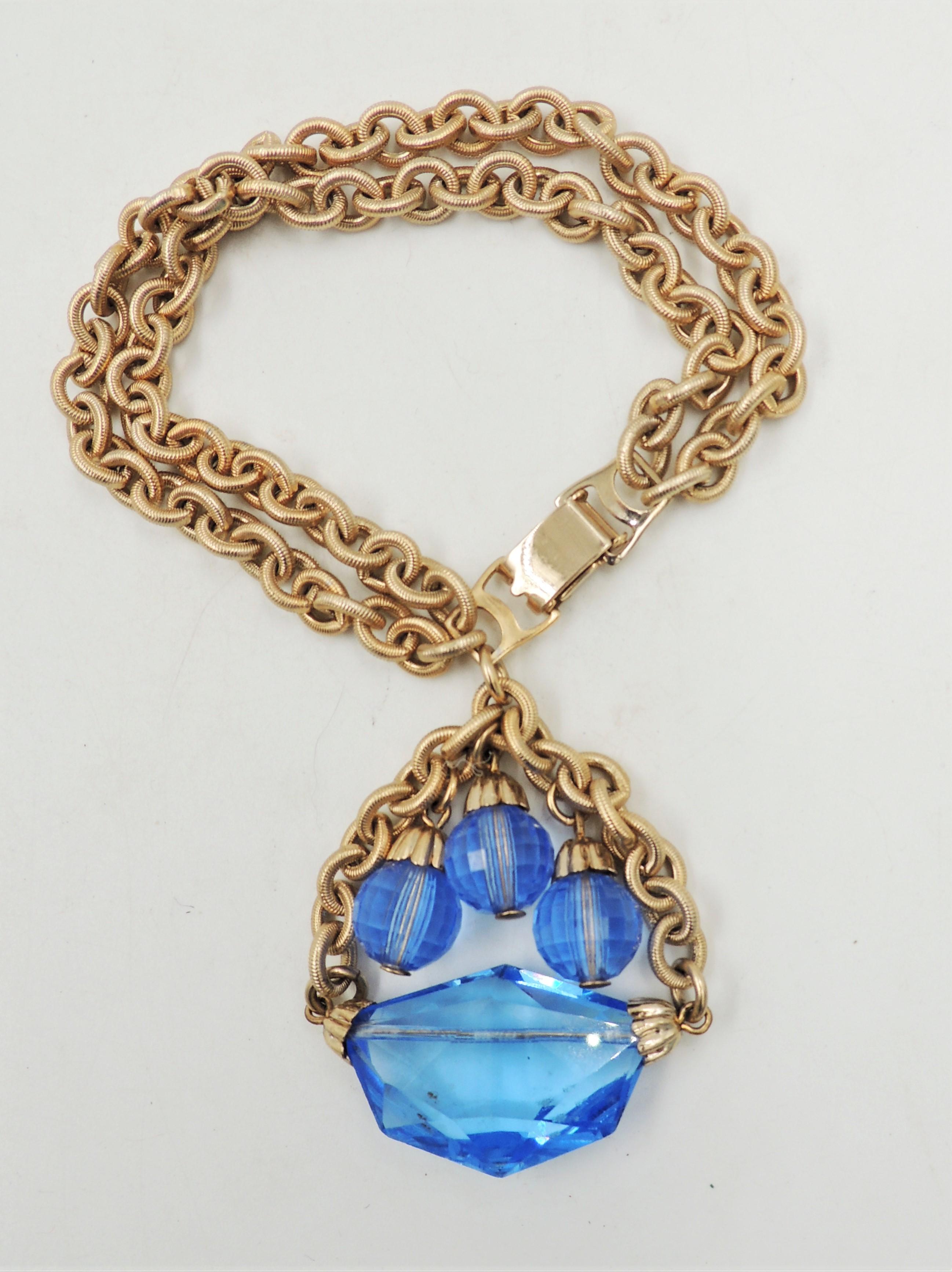 Vintage 1950s Signed Napier Goldtone & Blue Glass Charm Bracelet In Excellent Condition In Easton, PA