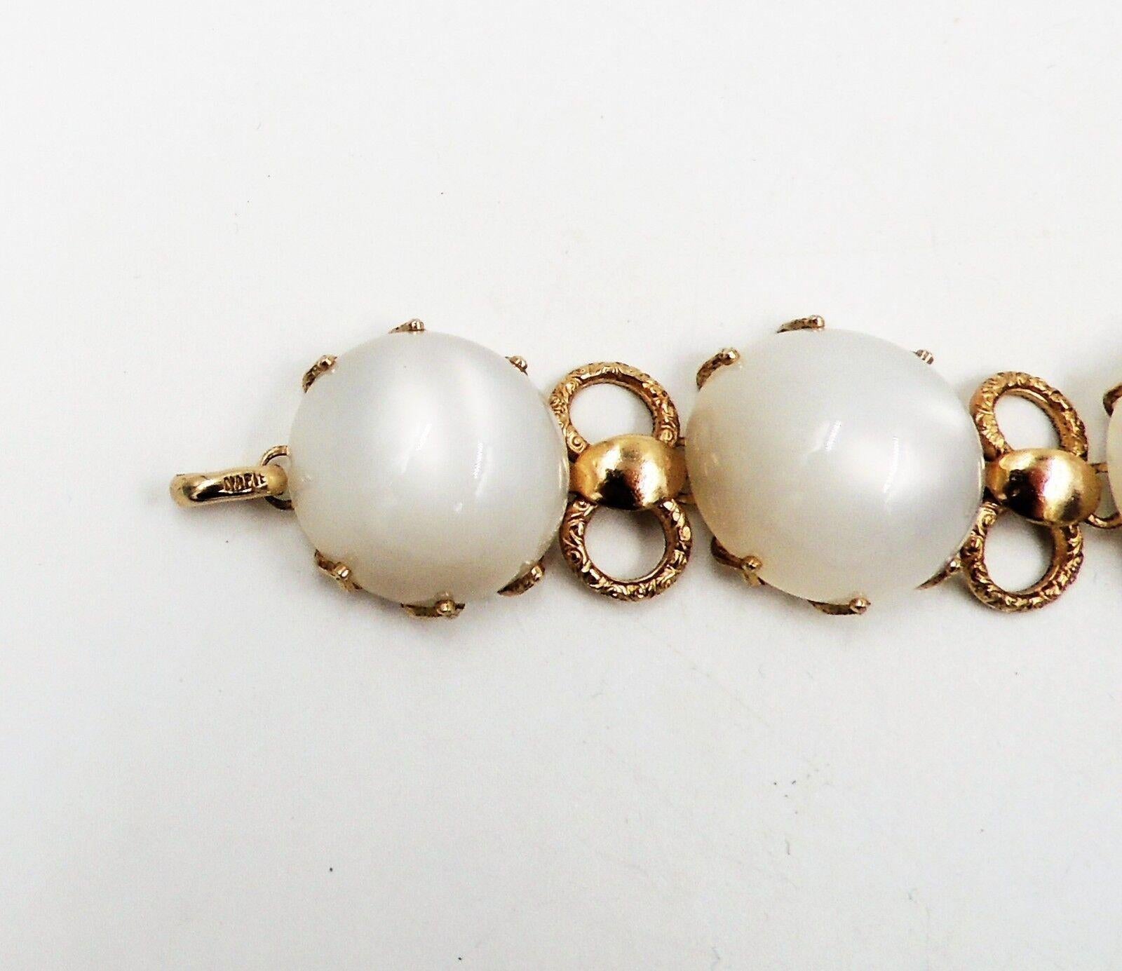 1950s goldtone cabochon faux-moonstone rhinestone bracelet with spring ring clasp. Marked 