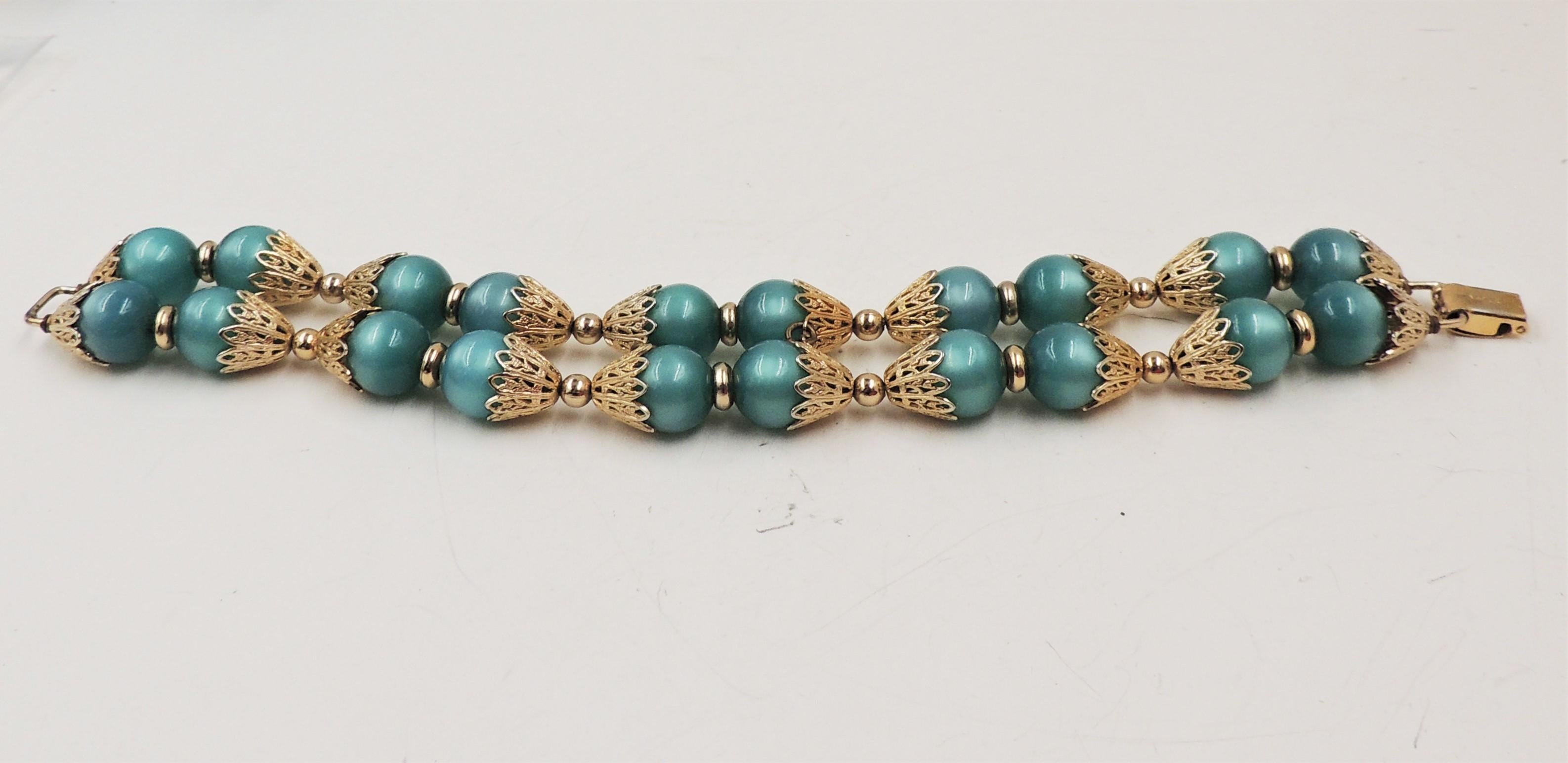 Modern Vintage 1950s Signed Napier Goldtone Green Moonglow Beaded Bracelet For Sale