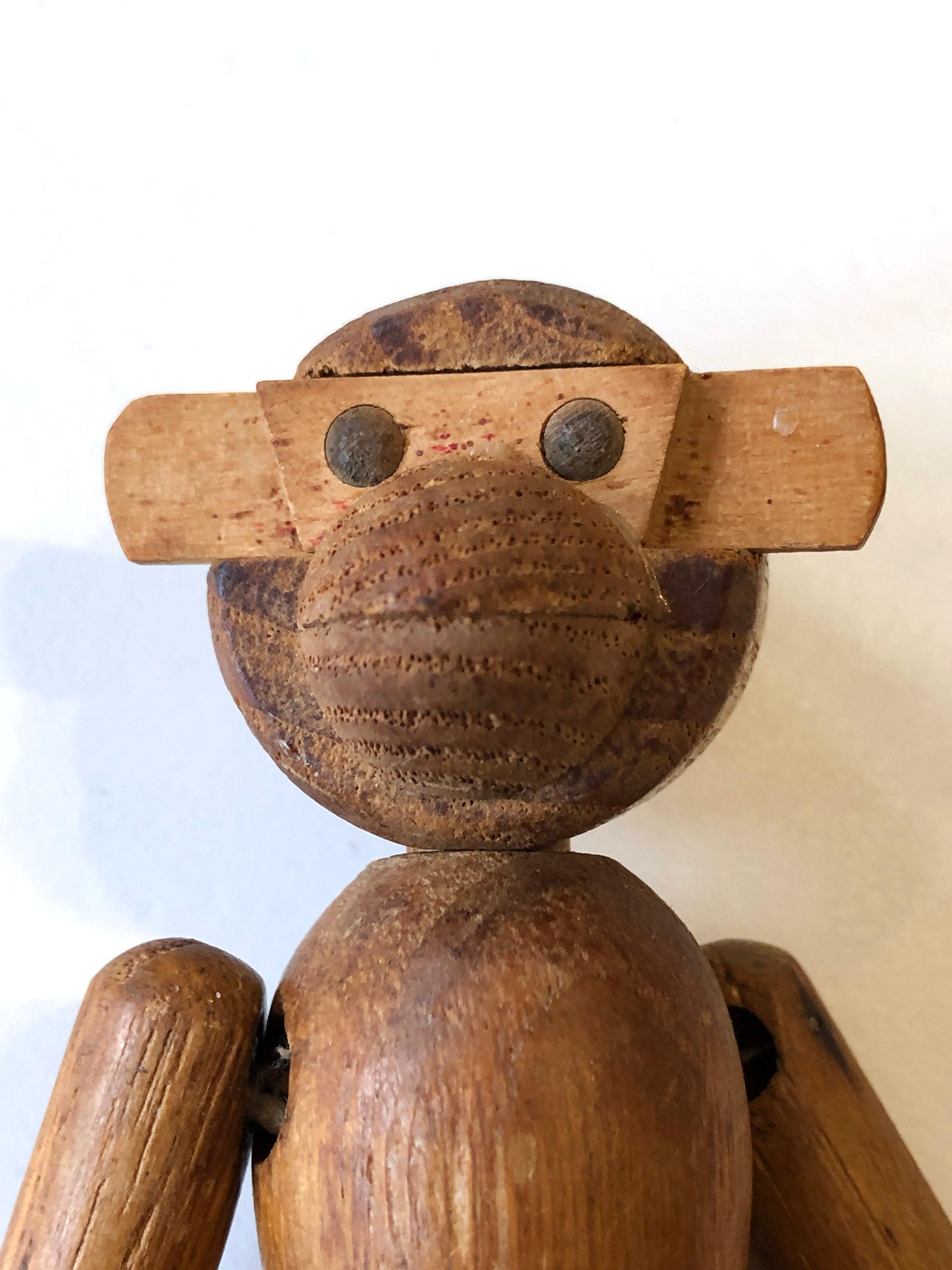 Small vintage 1950's wooden monkey by Kay Bojesen.
In nice original condition - beautiful patina on the wood - one piece of the monkeys left hand is missing. 
See pictures. You can easily restore it.