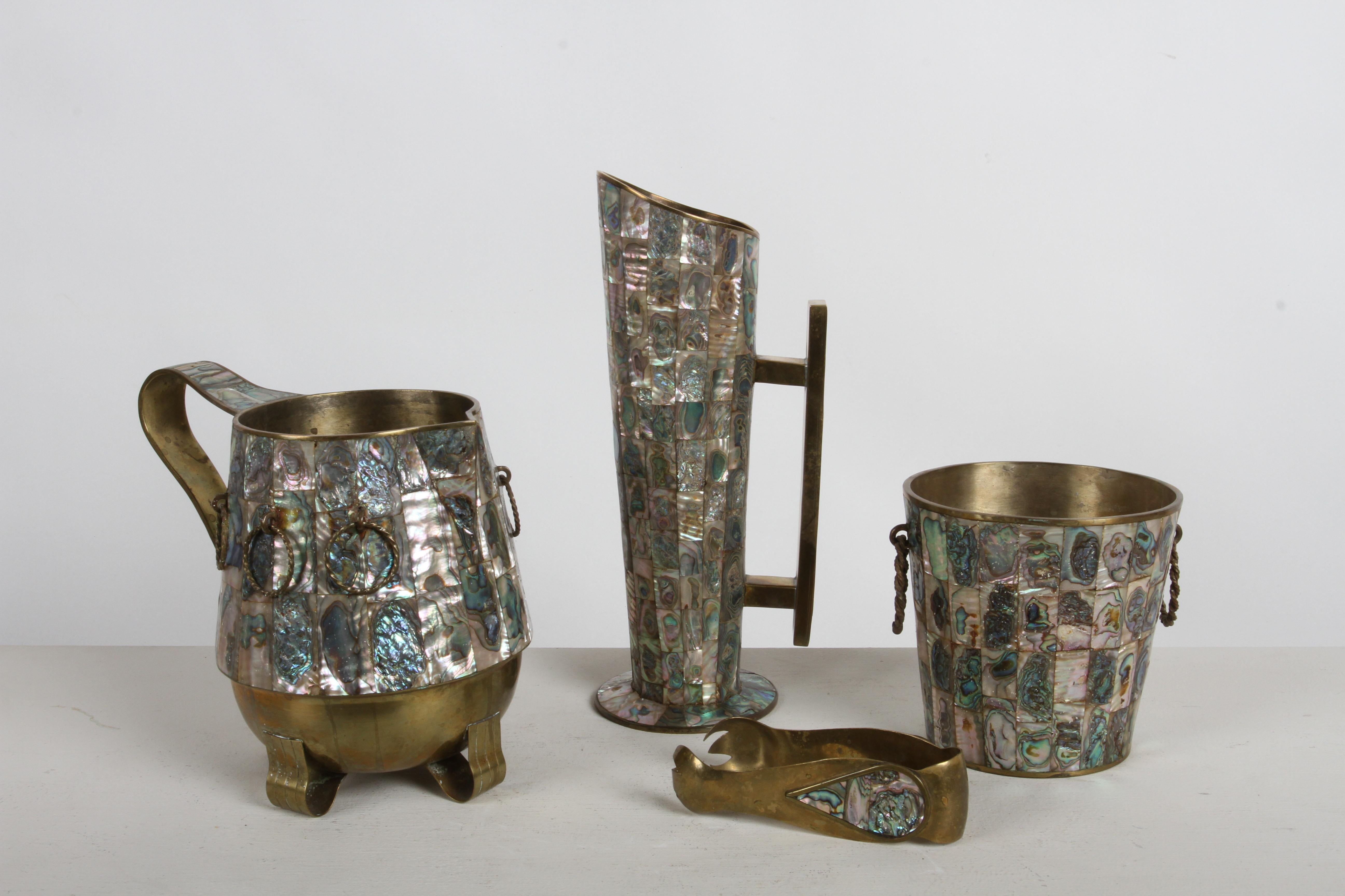 Fabulous 1950s rare complete entertaining bar service set from Taxco Mexico, brass with inlaid abalone shell in the style of Los Castillo. Set consist of water pitcher, cocktail pitcher, ice bucket complete with ice thongs and all are great examples