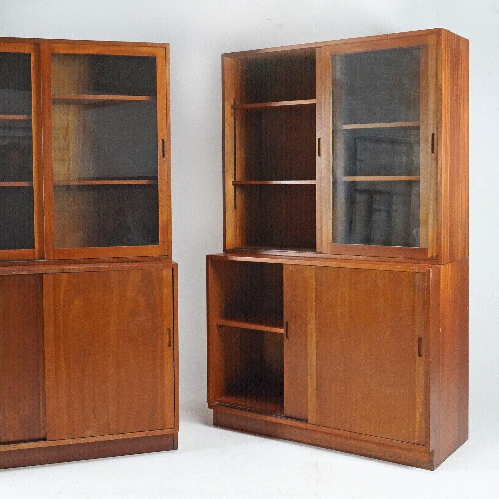 A fantastic free-standing solid teak display cabinet from the 1950's
This piece offers so much storage and would look fantastic in a sitting room or dining room - showcasing all your favourite items. The cupboard has sliding glazed doors on top