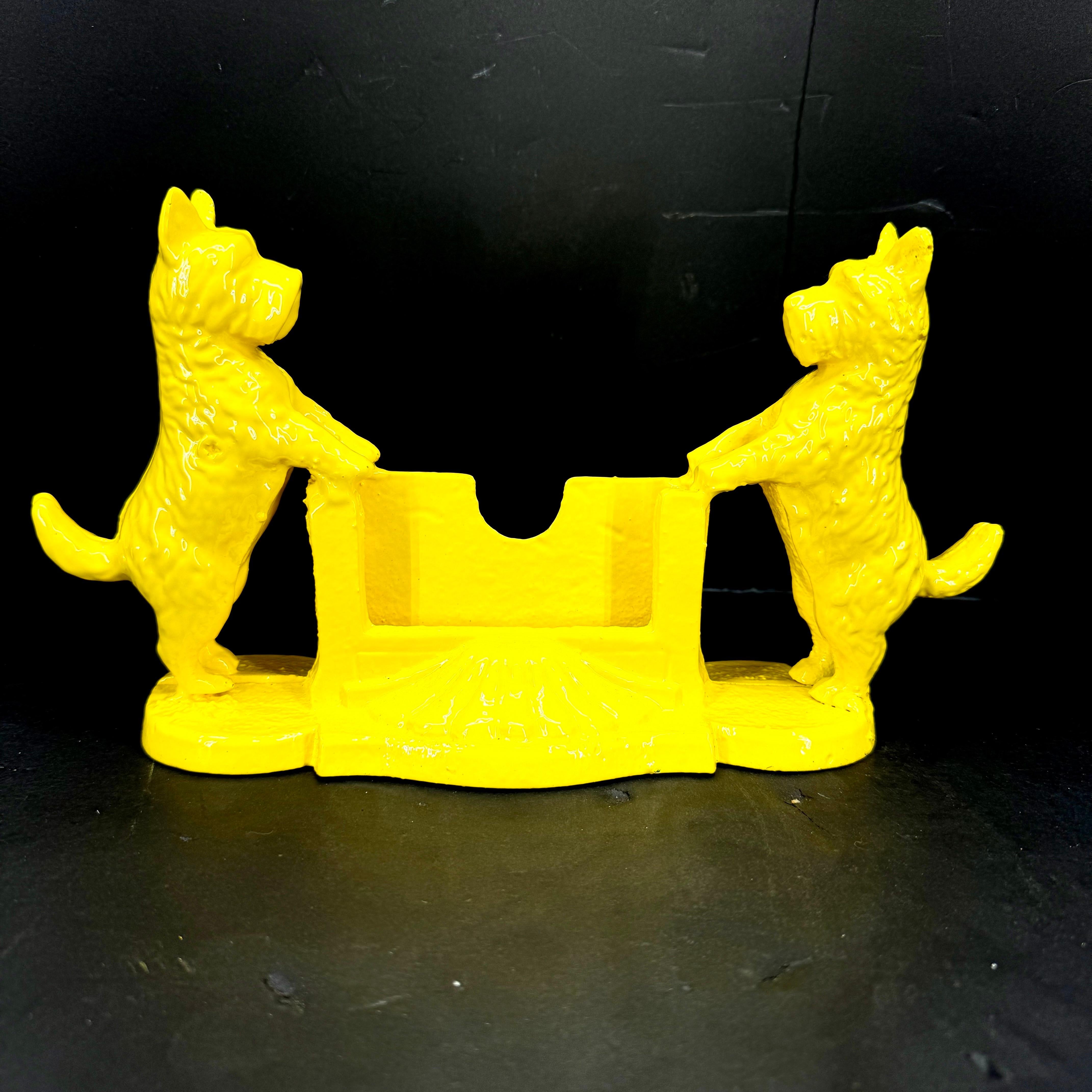 Cast iron card holder powder-coated in sunshine yellow.  Add a pop of color with this one-of-a-kind piece on your desk or retail space. Makes a great gift for any animal lover as well. 