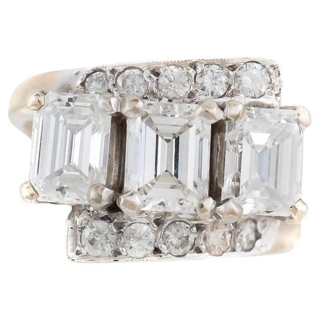 Vintage 1950s Three Stone 3.00 Carat Emerald Cut Diamond Ring