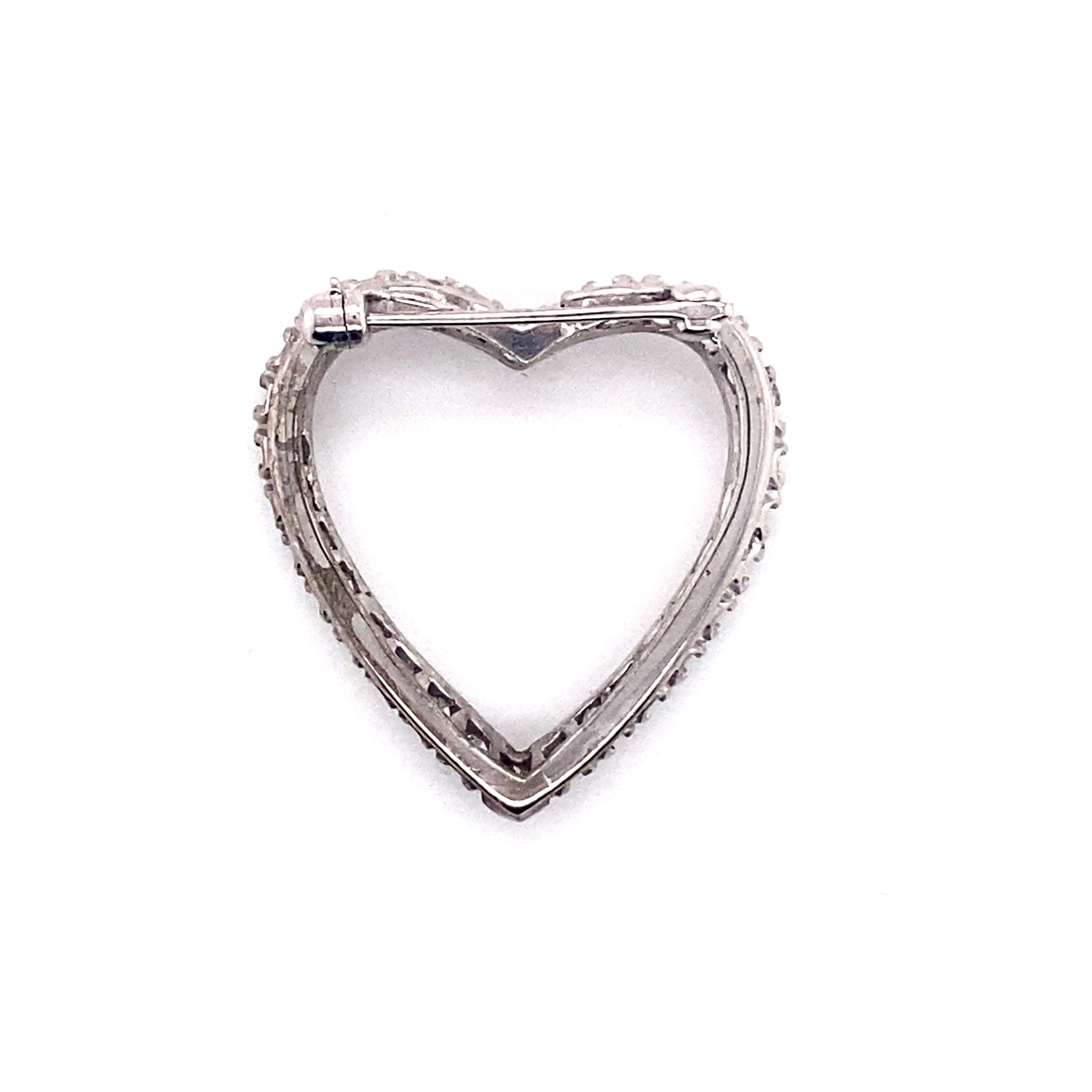 Vintage 1950’s White Gold Diamond Heart Pin and Pendant. There are 30 single cut diamonds prong set and weigh approximately 1.20ct total weight. The diamond quality is H - I color and VS1 - SI2 clarity. The pin measures 1